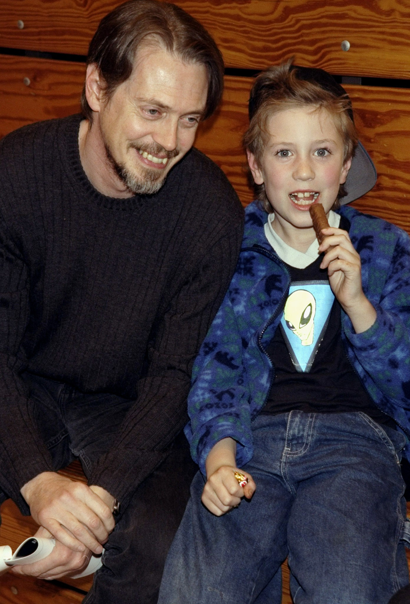 Steve Buscemi with his son Lucien, 7, attend a charity basketball game at Hunter College | Source: Getty Images