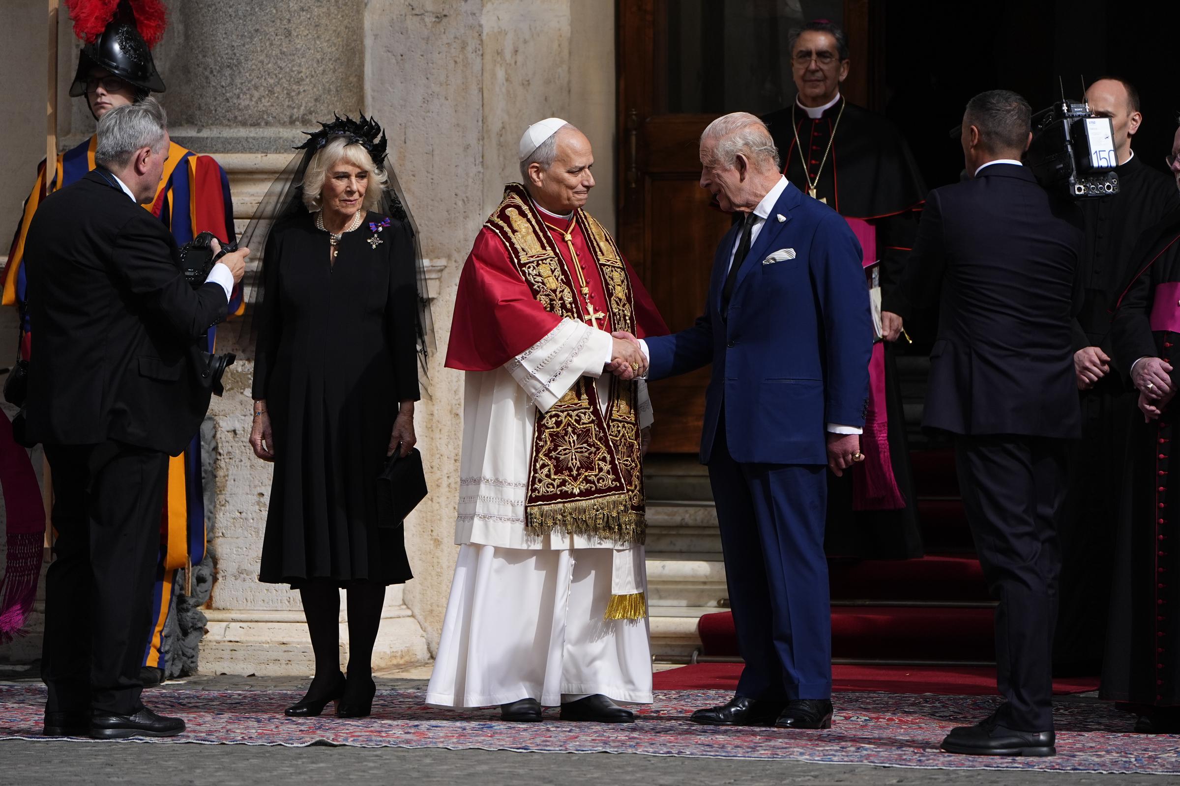 King Charles III and Queen Camilla say goodbye to Pope Leo XIV in the San Damaso Courtyard, in St Peter's Square, after attending the ecumenical service on October 23, 2025 | Source: Getty Images