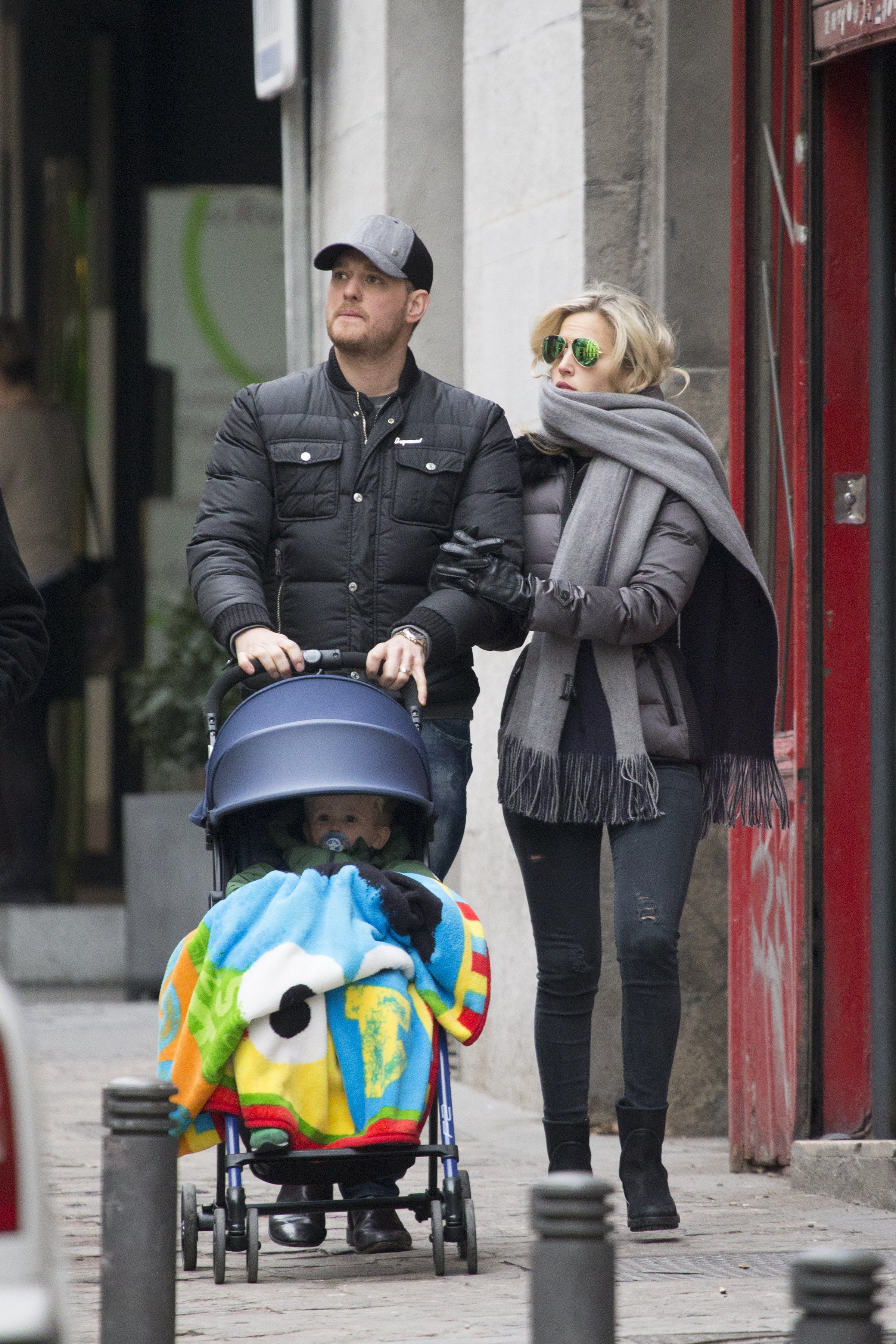 Michael Bublé and Luisana Lopilato strolling with their son Noah on February 12, 2015, in Madrid, Spain. | Source: Iconic/GC Images/Getty Images