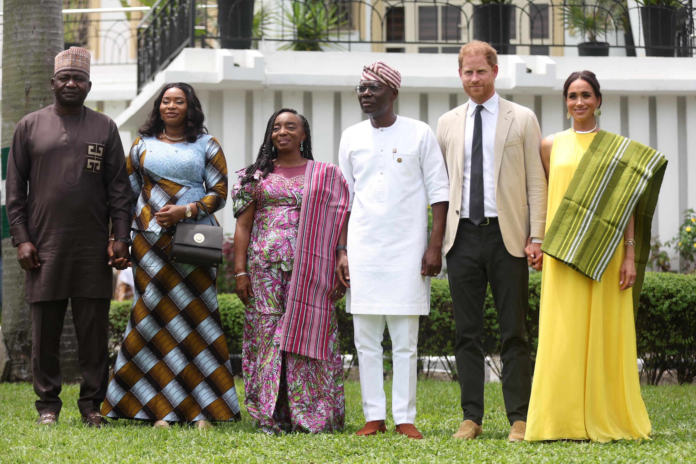 Nigeria Chief of Defense Staff Christopher Musa, his wife Lilian Musa, Lagos State Governor Babajide Sanwo-Olu, his wife Ibijoke Sanwo-Olu, Prince Harry, and Meghan Markle at the Governor's House in Lagos on May 12, 2024 | Source: Getty Images