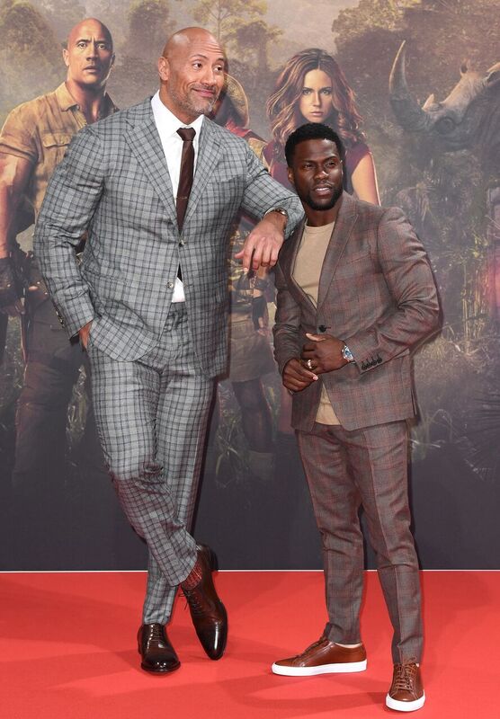 Dwayne "The Rock" Johnson and Kevin Hart during a "Jumanji" premiere | Source: Getty Images/GlobalImagesUkraine