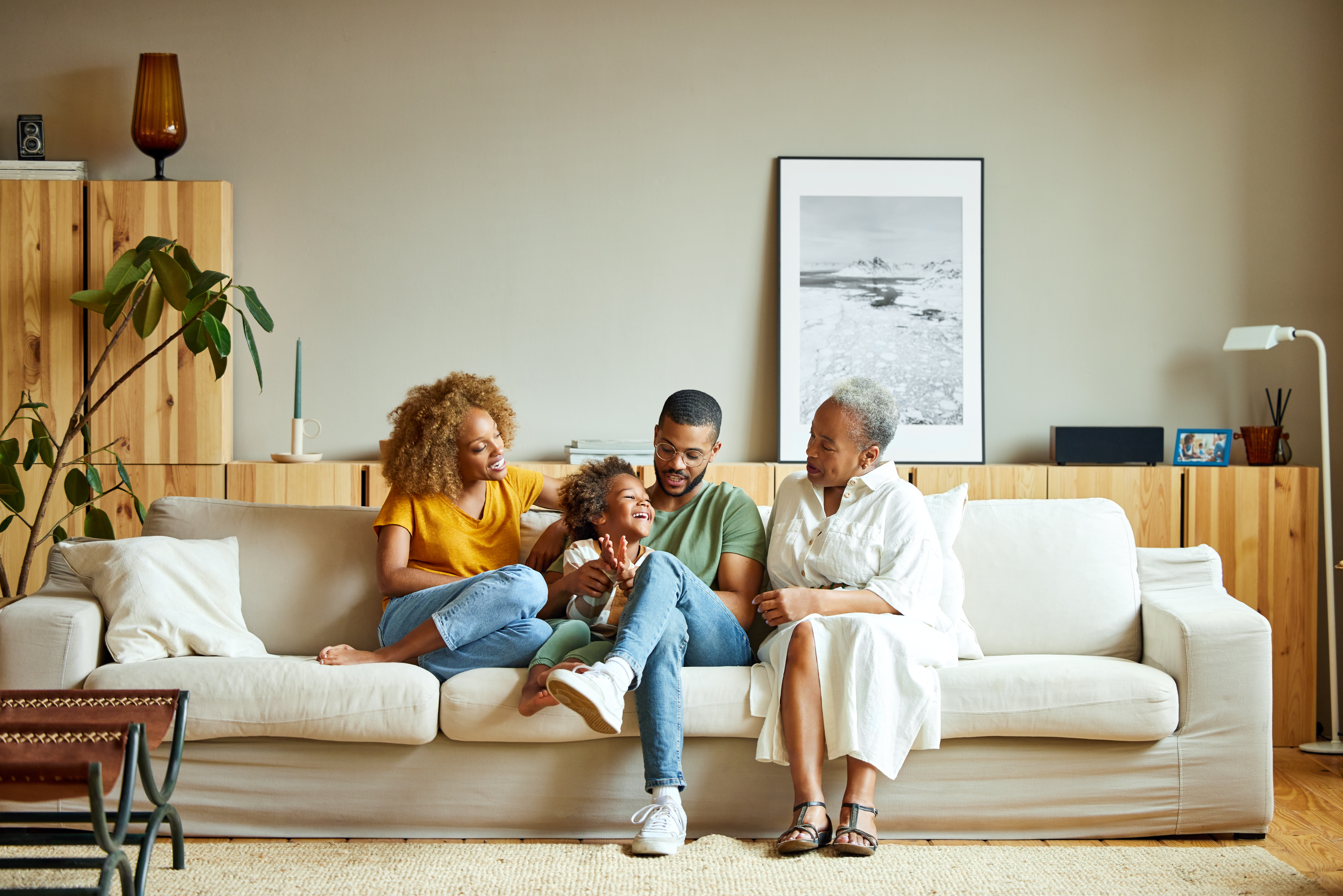 African American happy family is enjoying in living room | Source: Getty Images