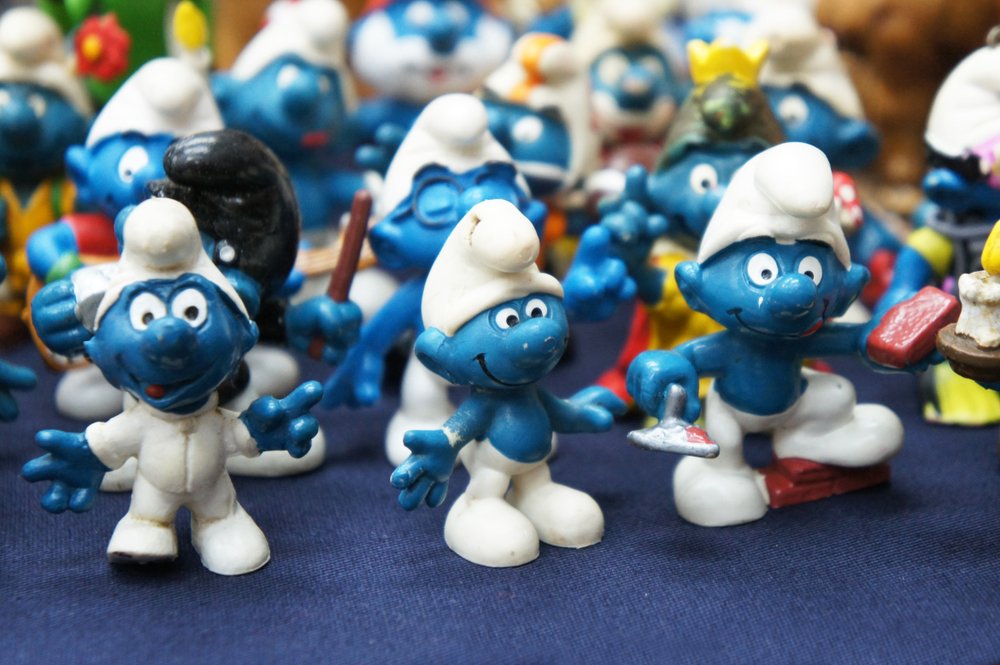 "The Smurfs" miniature figurines displayed for the public on a desk in Kuala Lumpur, Malaysia on December 9, 2018 | Photo: Shutterstock/Aisyaqilumaranas