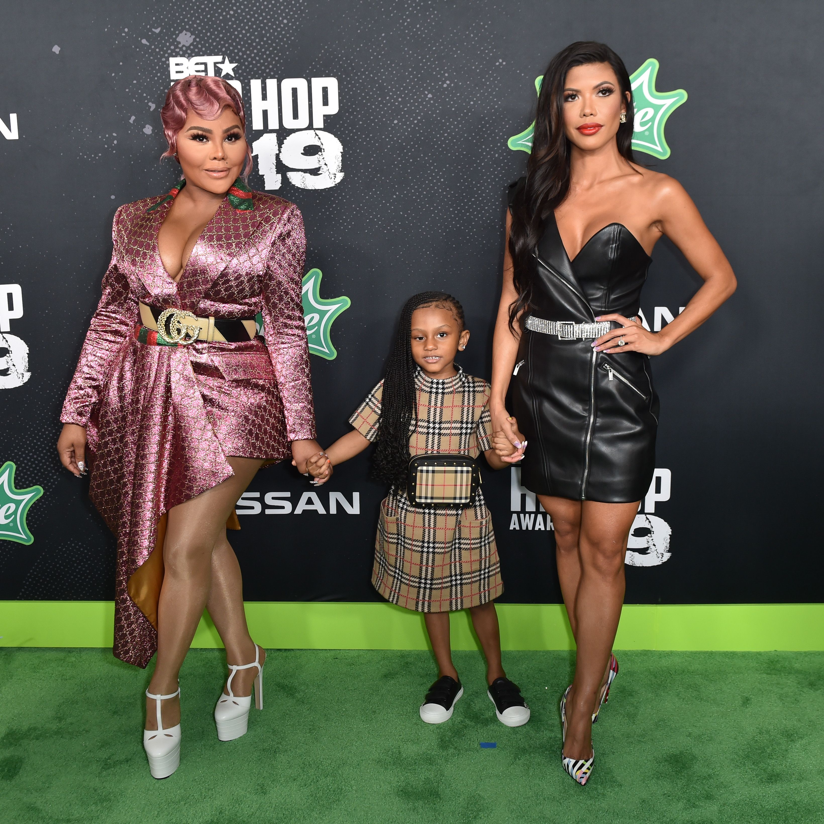 Lil' Kim, Royal Reign, and a guest during the 2019 BET Hip Hop Awards on October 05, 2019, in Atlanta, Georgia. | Source: Getty Images