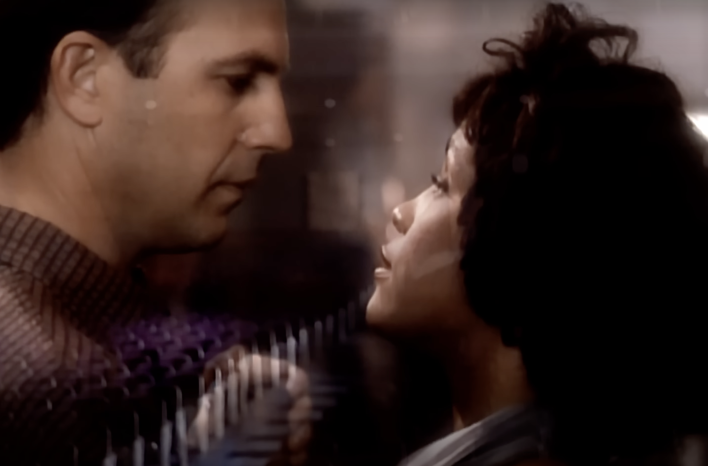 Kevin Costner and Whitney Houston in a scene from "The Bodyguard," shared via Whitney Houston's music video for "I Will Always Love You," posted on September 28, 2010 | Source: YouTube/Whitney Houston