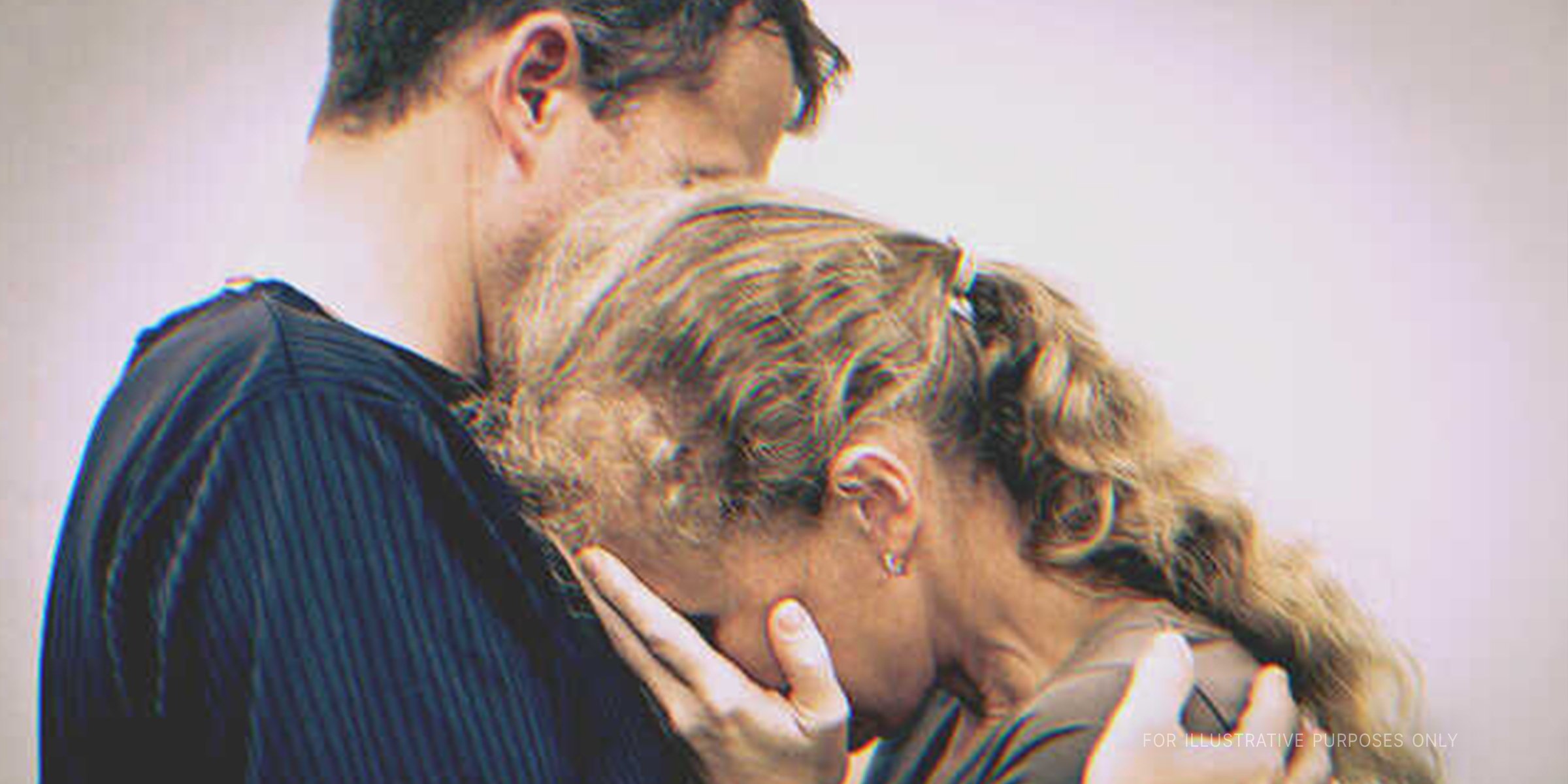 Woman Crying on Husband's Shoulder. | Source: Shutterstock