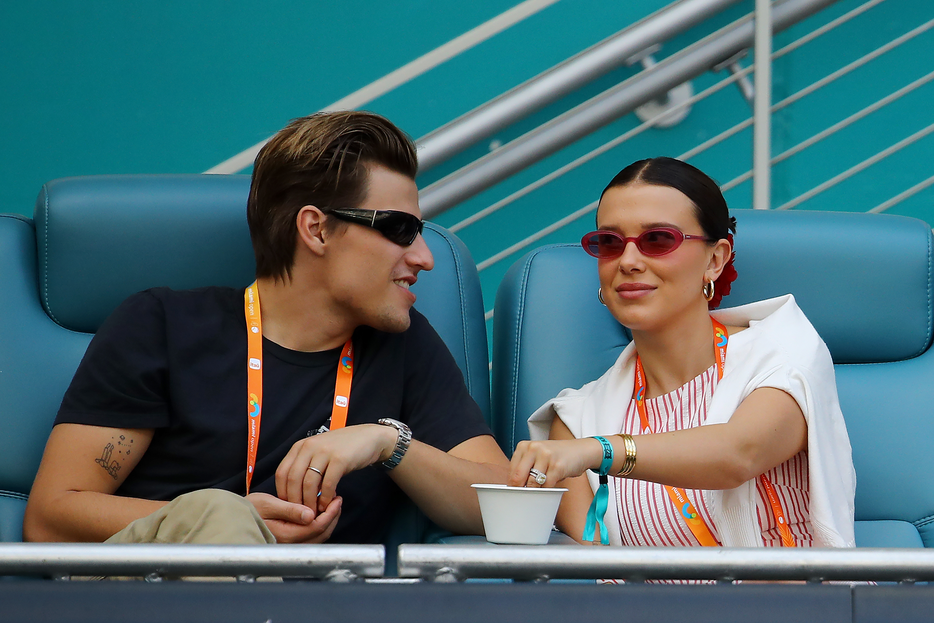 Jake Bongiovi and Millie Bobby Brown are at the Aryna Sabalenka and Jasmine Paolini of Italy match for the women's semifinal of the Miami Open at Hard Rock Stadium in Florida on March 27, 2025 | Source: Getty Images