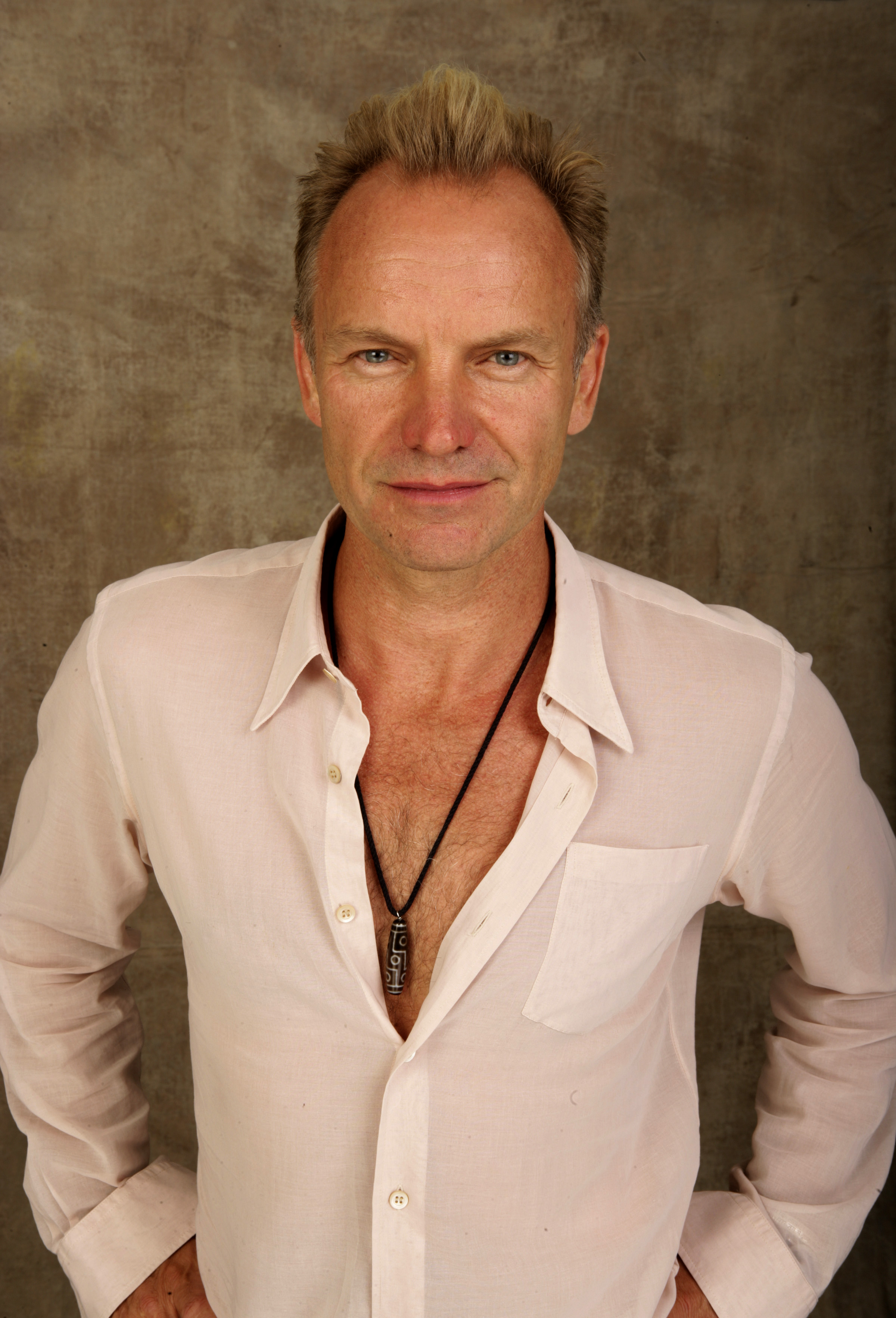 Sting poses for a studio portrait backstage at "Live 8 London" in Hyde Park in London, England on July 2, 2005. | Source: Getty Images
