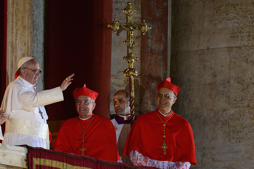 Newly elected Pope Francis I waves to the waiting crowd from the central balcony of St Peter's Basilica on March 13, 2013 in Vatican City, Vatican. Argentinian Cardinal Jorge Mario Bergoglio was elected as the 266th Pontiff and will lead the world's 1.2 billion Catholics