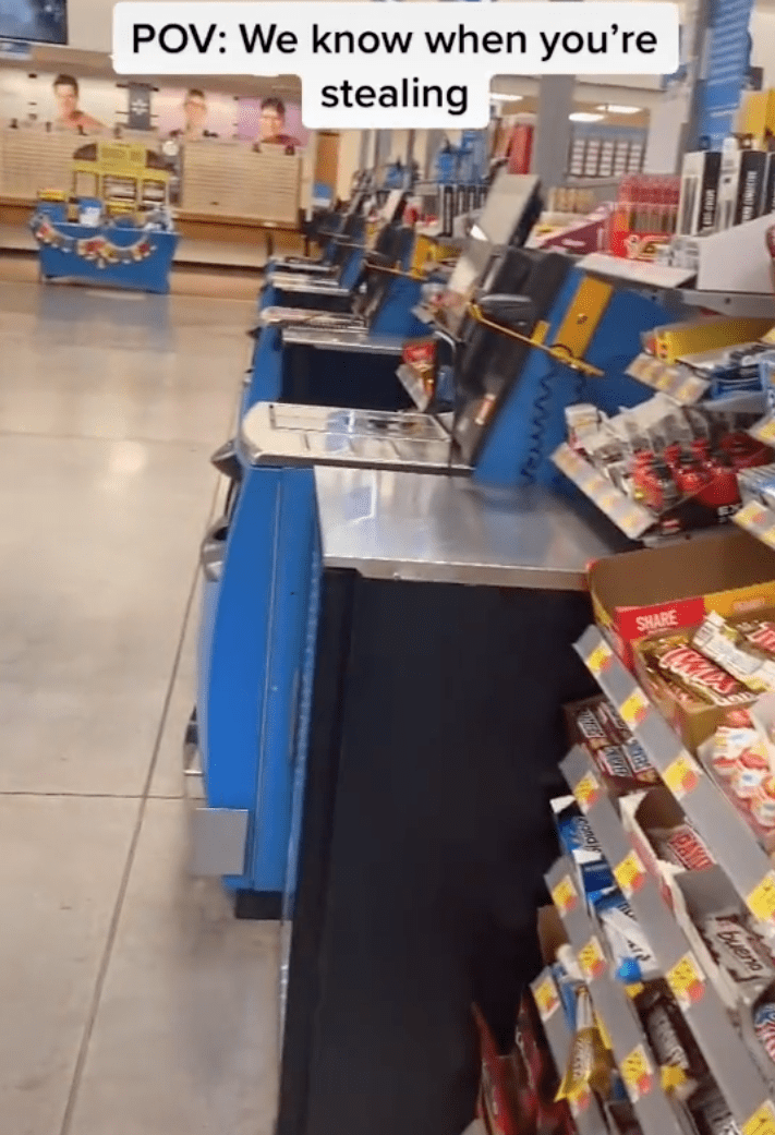 Purported Walmart employee pans the store to show viewers they are being tracked at the self-service section | Photo: TikTok/thewalmartguy69