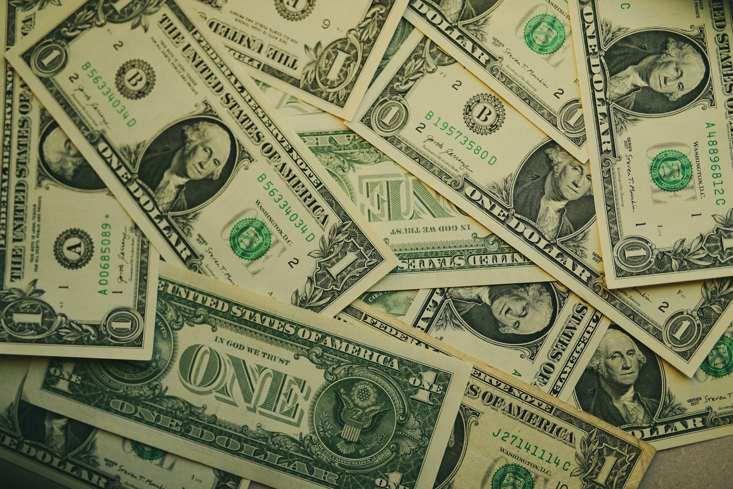 A pile of dollars | Source: Unsplash