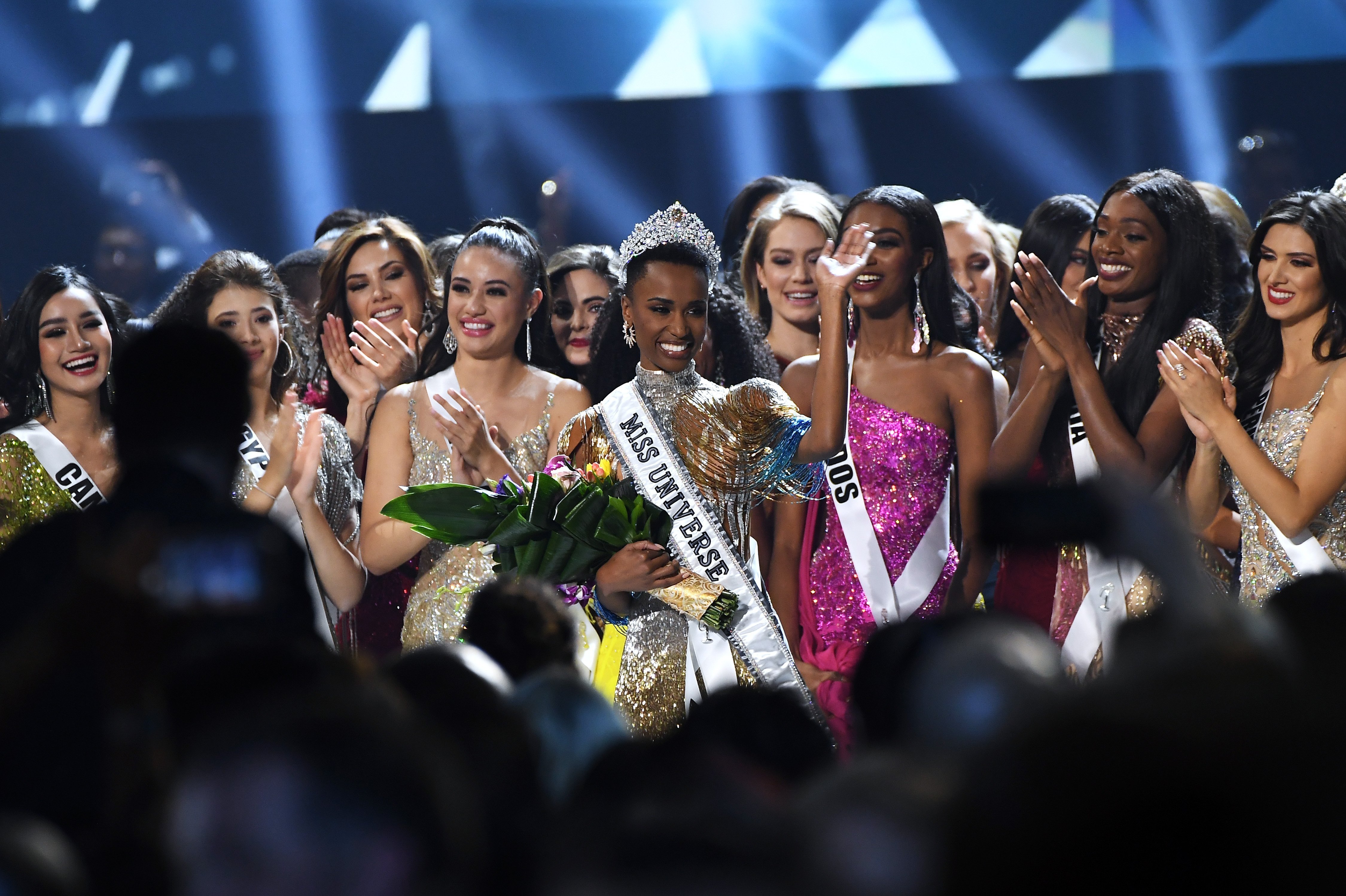 South African Zozibini Tunzi stands out amid a sea of beautiful women as she is crowned Miss Universe 2019. | Photo: Getty Images