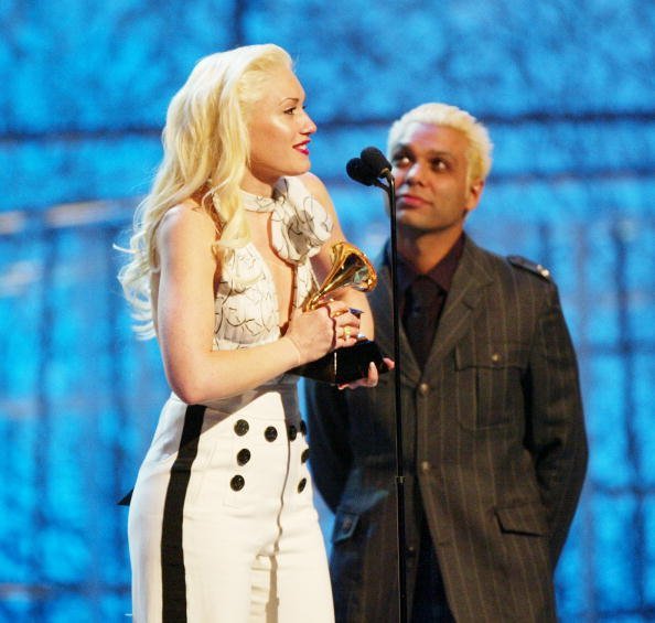 Gwen Stefani and Tony Kanal of No Doubt accept the Grammy for Best Pop Performance By A Duo Or Group With Vocal at the 46th Annual Grammy Awards held at the Staples Center on February 8, 2004, in Los Angeles, California. | Source: Getty Images.
