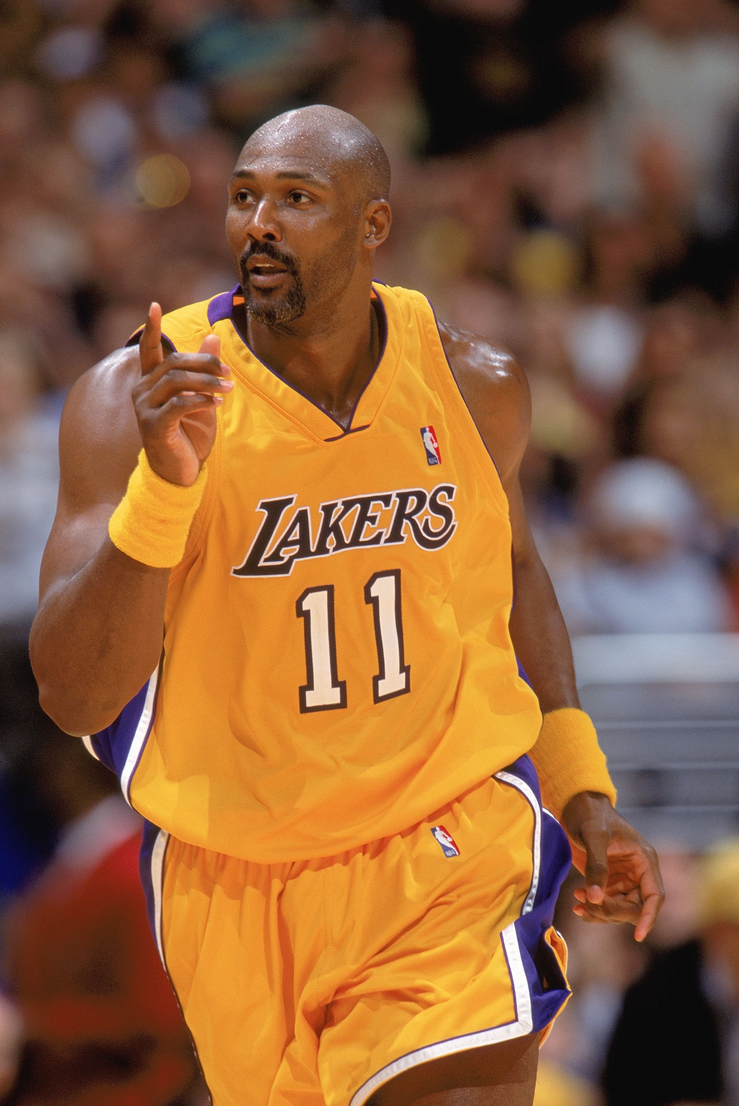 Karl Malone plays for the Los Angeles Lakers at the 2004 NBA Playoffs against the Houston Rockets | Source: Getty Images 
