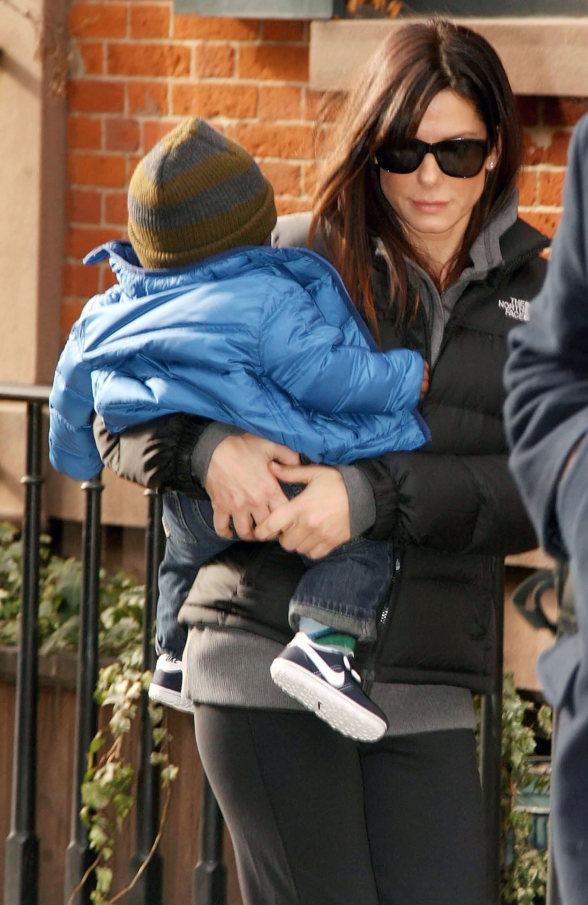 Sandra Bullock is seen carrying her son, Louis Bardo Bullock, on January 20, 2011, in New York City | Source: Getty Images
