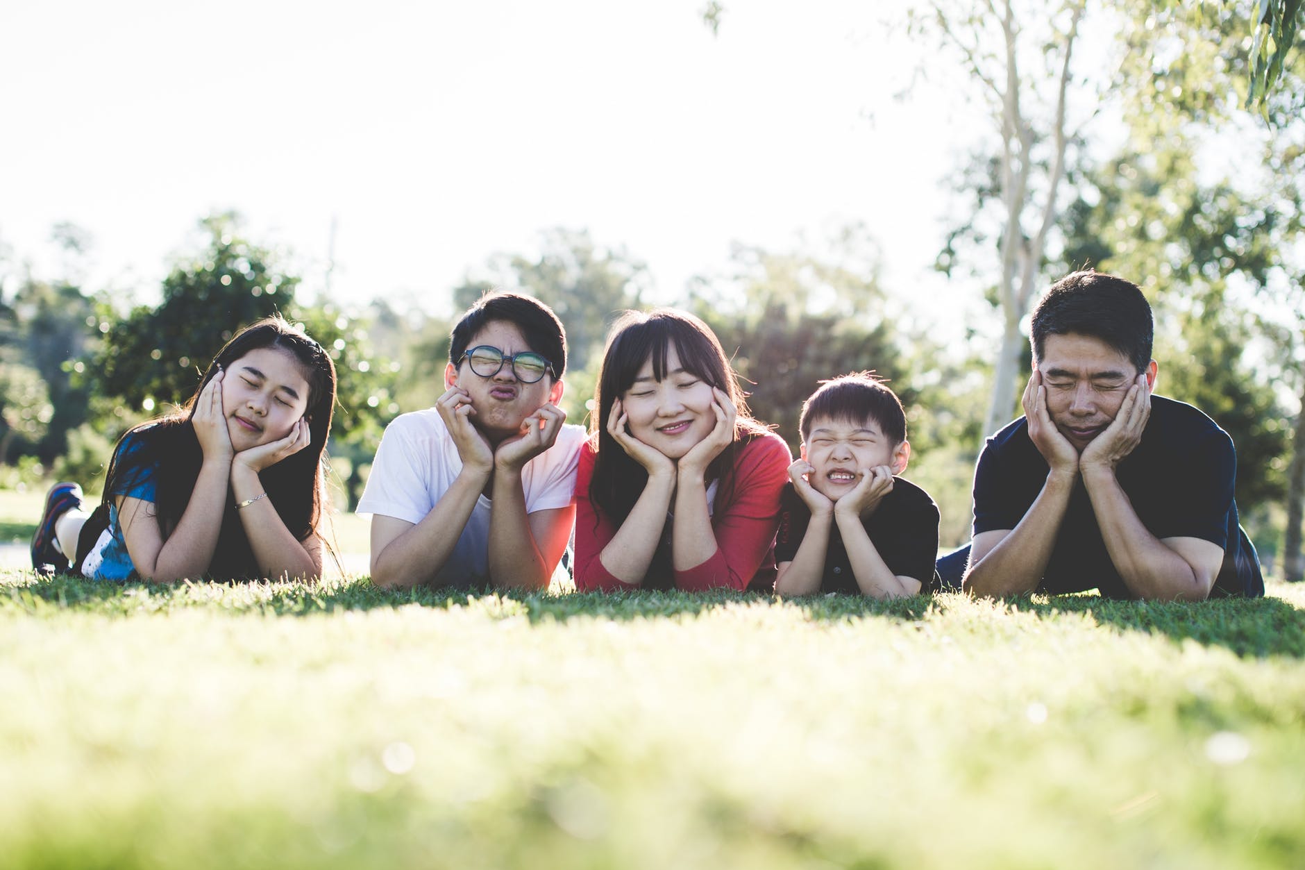 A portrait of an Asian family outdoor. | Photo: Pixabay