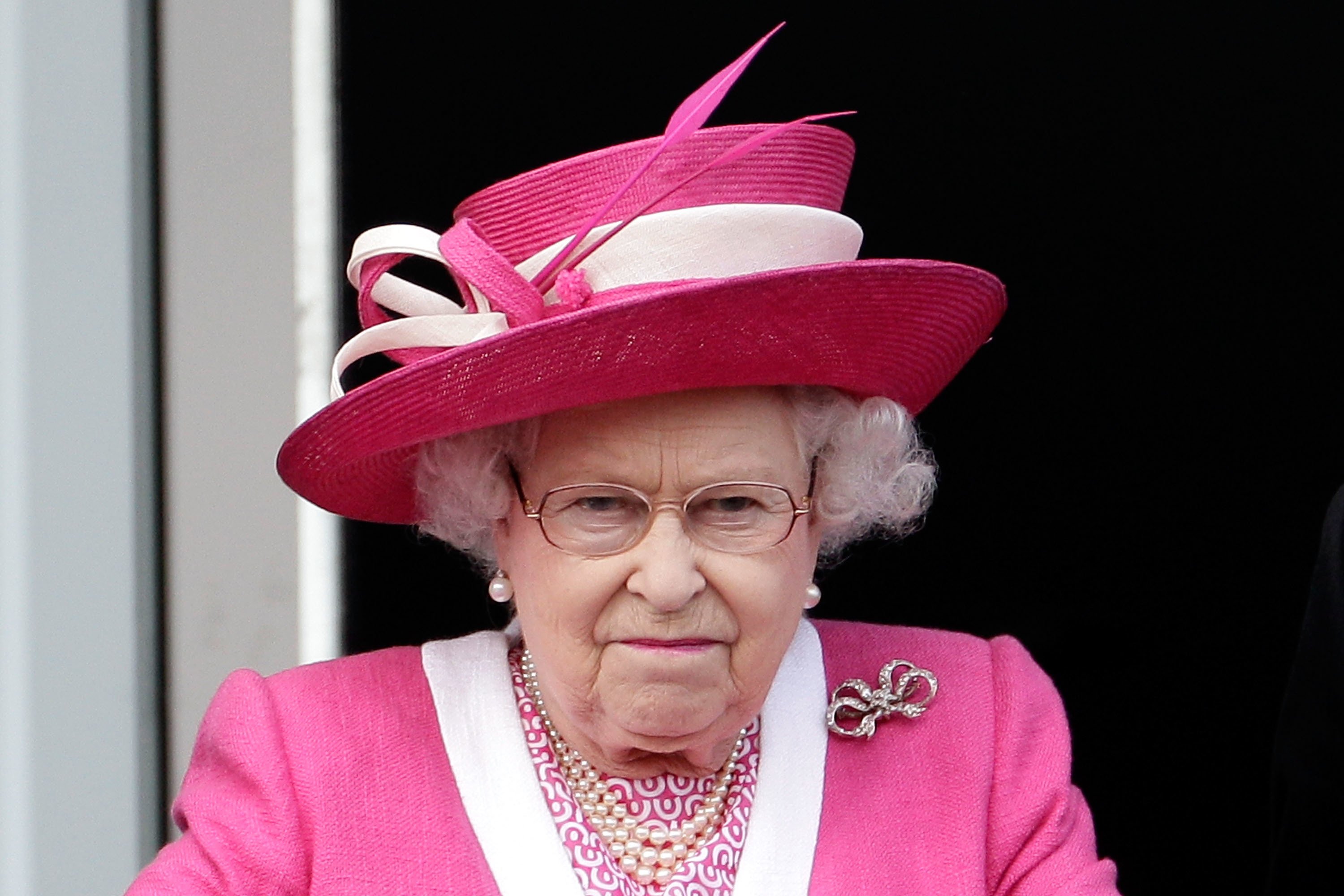 Queen Elizabeth II reacts after her horse Carlton House comes in third in the Epsom Derby at Epsom Downs racecourse | Photo: Getty Images