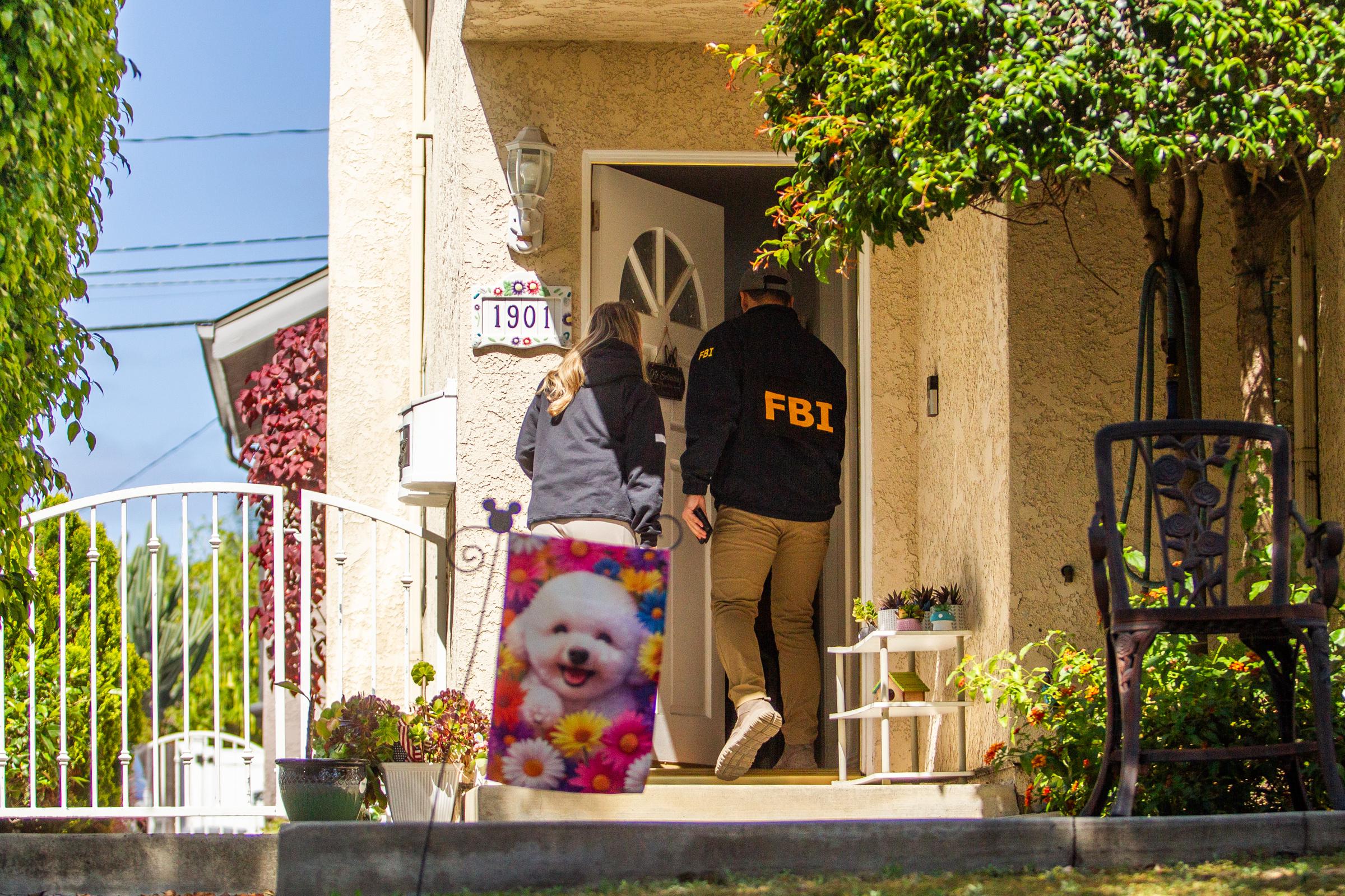 FBI agents canvass the neighborhood of the suspected White House Correspondents' Dinner shooter on April 26, 2026, in Torrance, California | Source: Getty Images