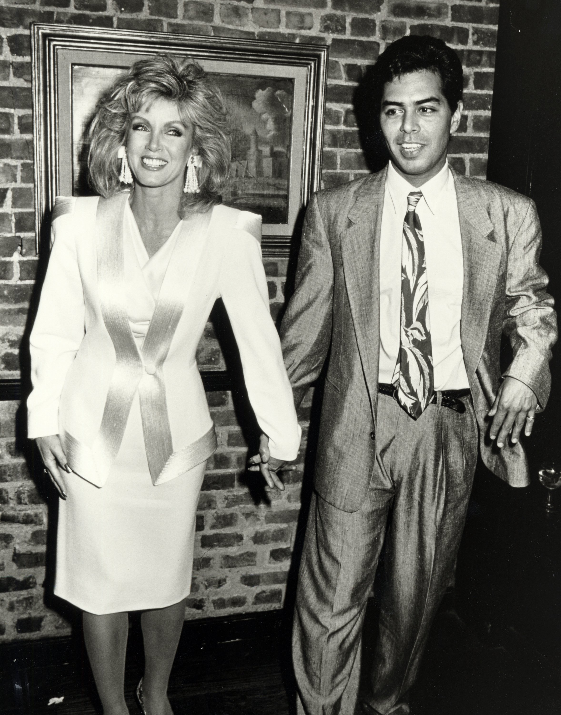 Donna Mills and Richard Holland during 1986 Femme Awards at Mortimer's Restaurant in New York City, New York. / Source: Getty Images