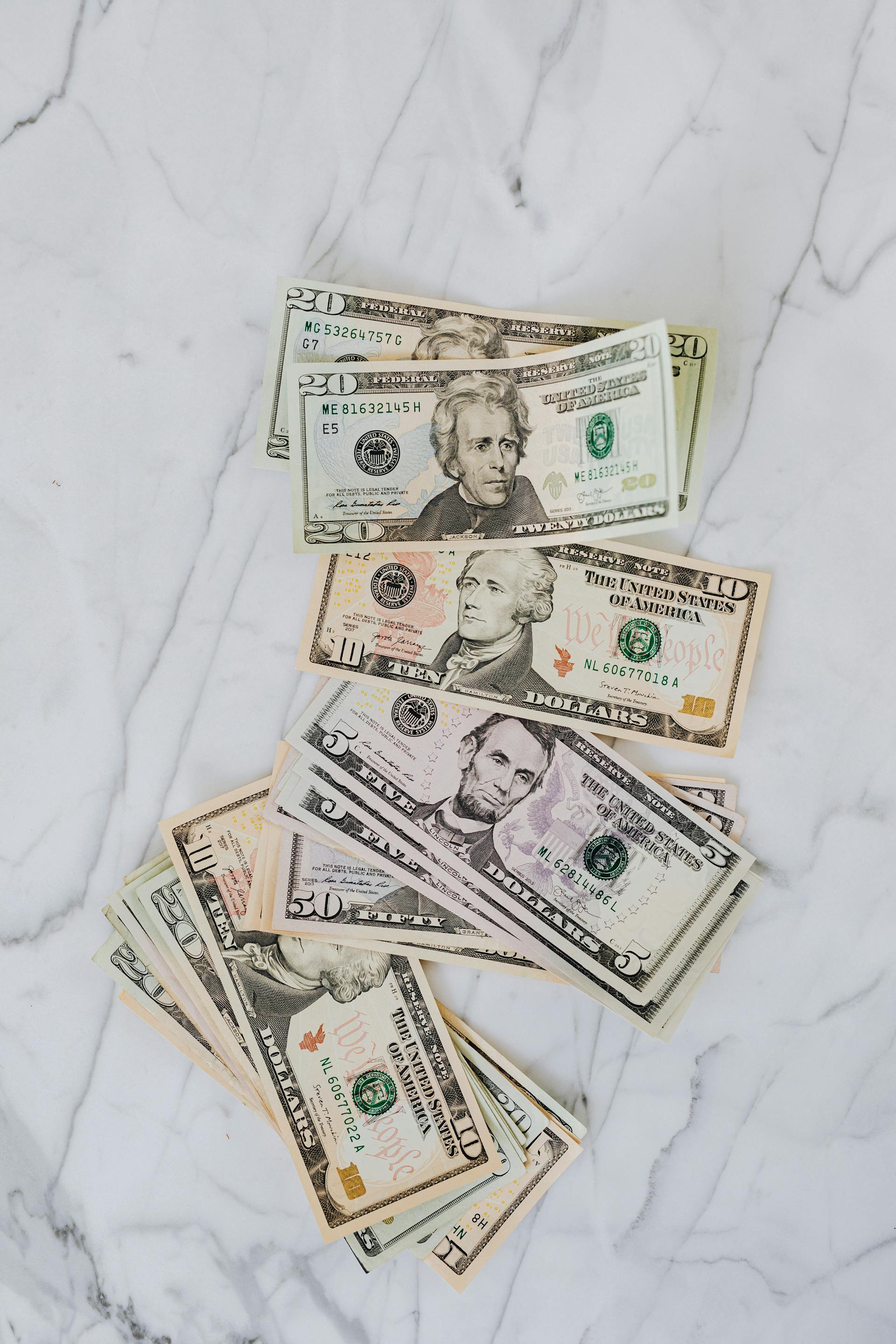 Dollar bills on a surface | Source: Pexels