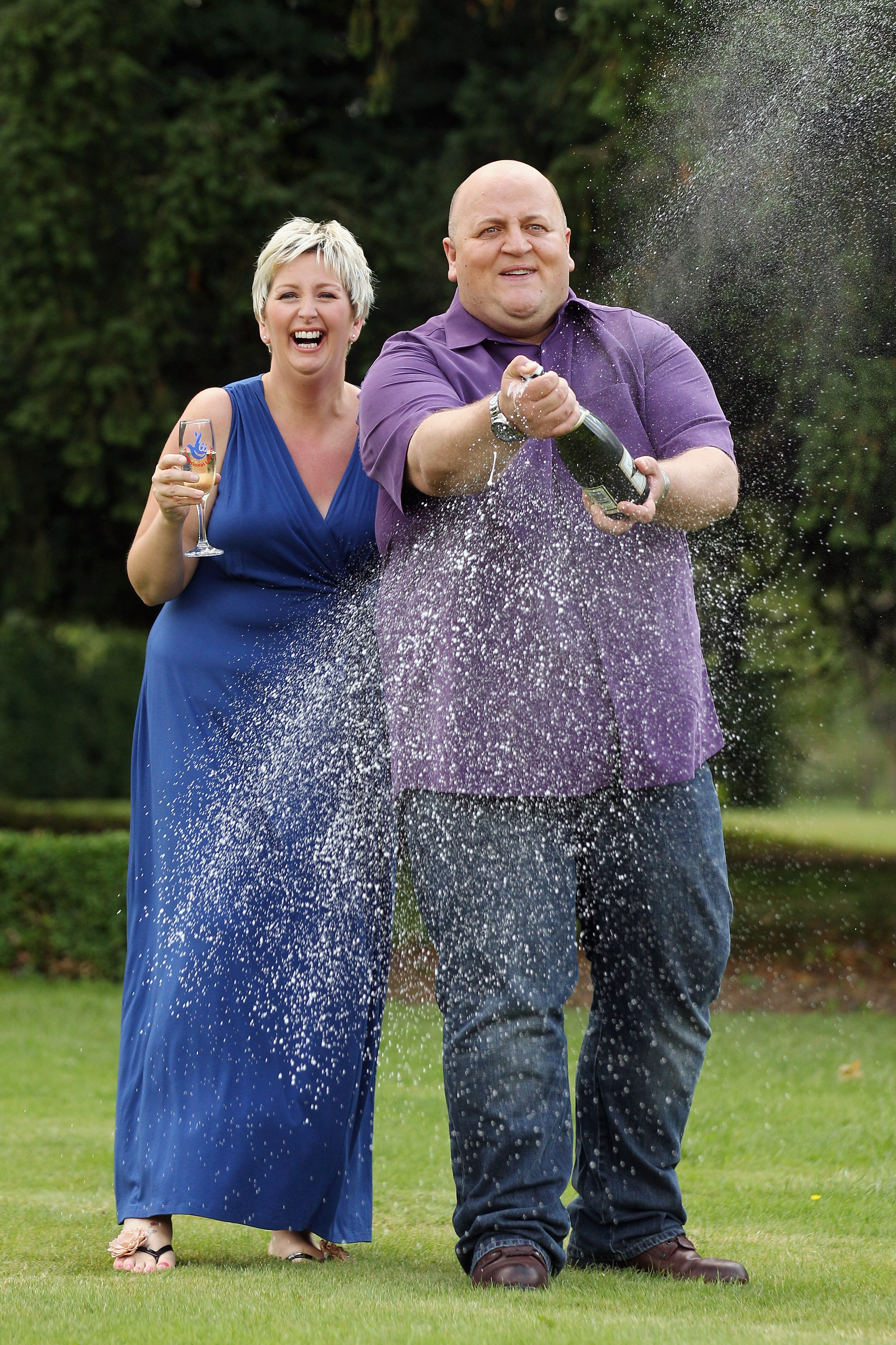 Gillian and Adrian Bayford celebrate winning the jackpot of over 148 million GBP in the EuroMillions lottery on August 14, 2012, in Hatfield Heath, England | Source: Getty Images