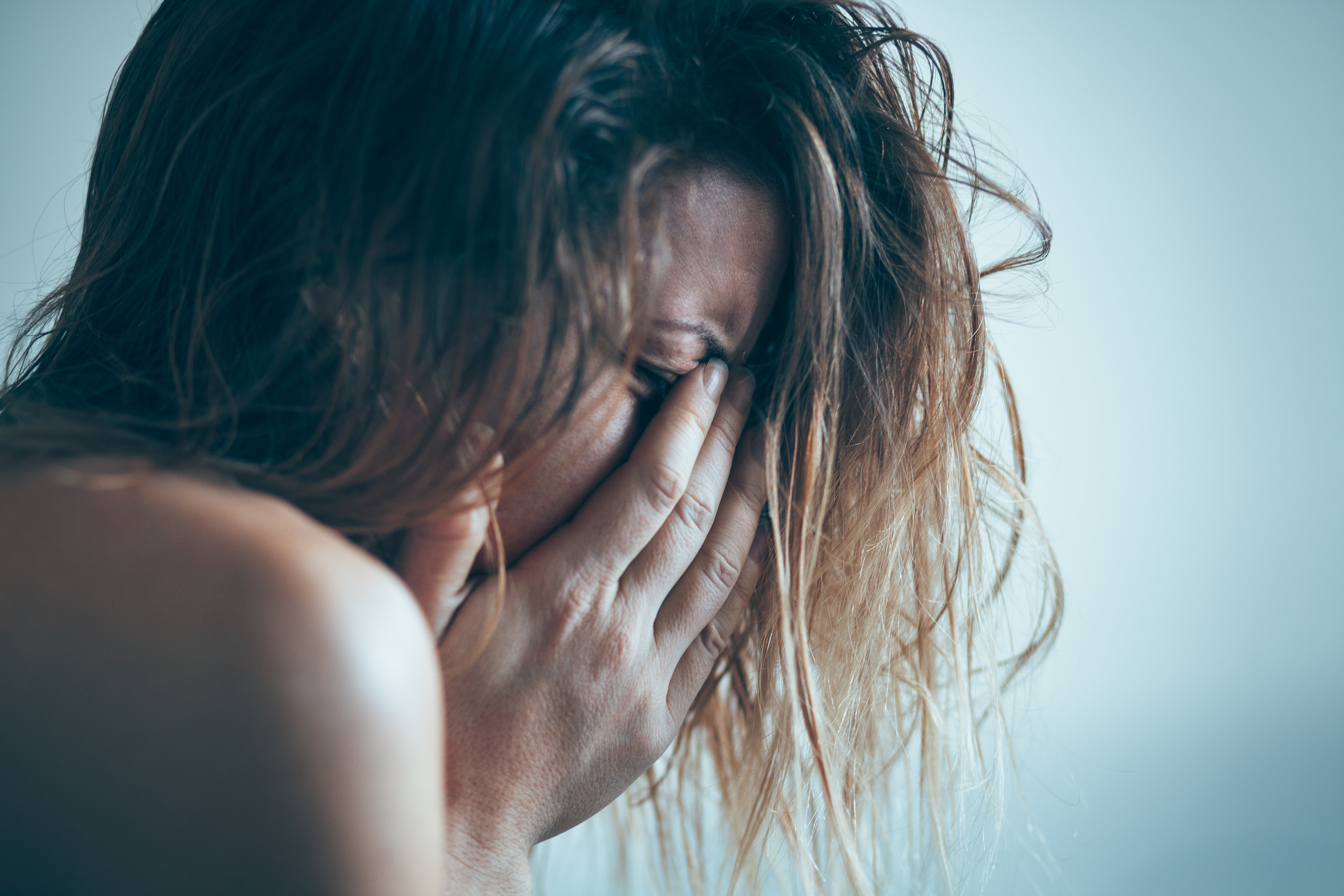 Young woman sad and crying | Source: Shutterstock