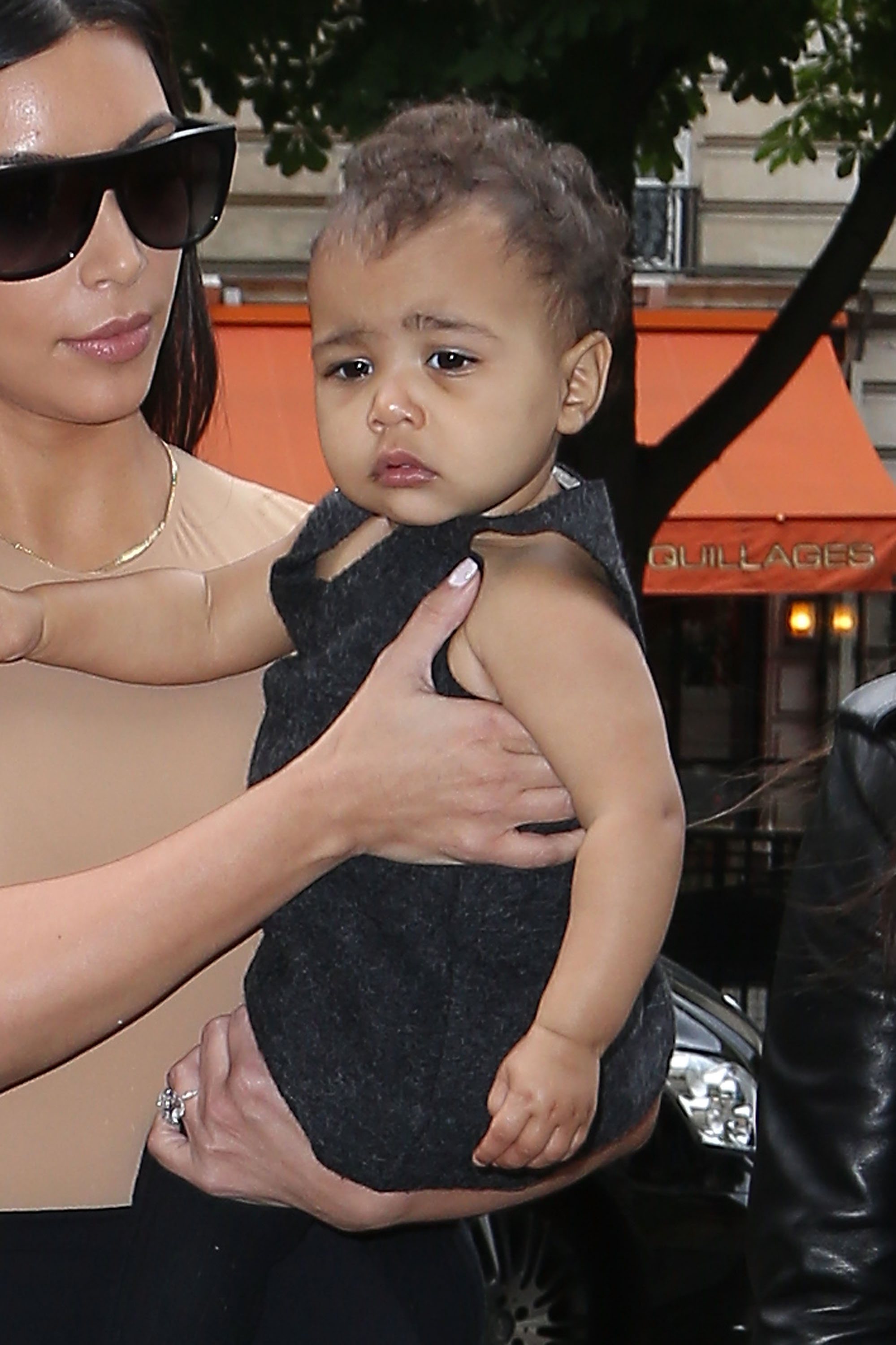 Kim Kardashian and North West arrive at the "Givenchy" store on May 20, 2014, in Paris, France. | Source: Getty Images