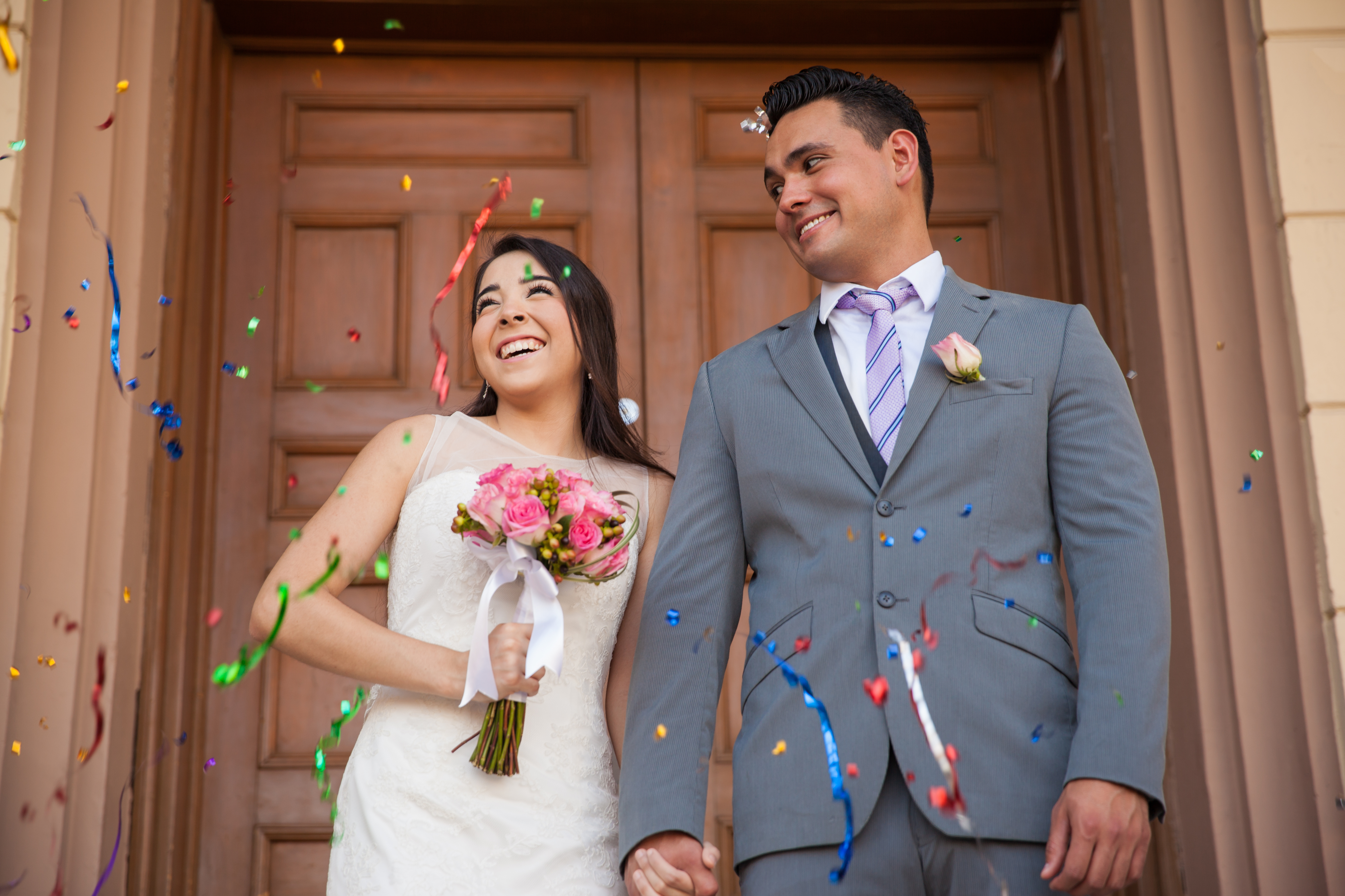 Bride and groom at a courthouse | Source: Shutterstock