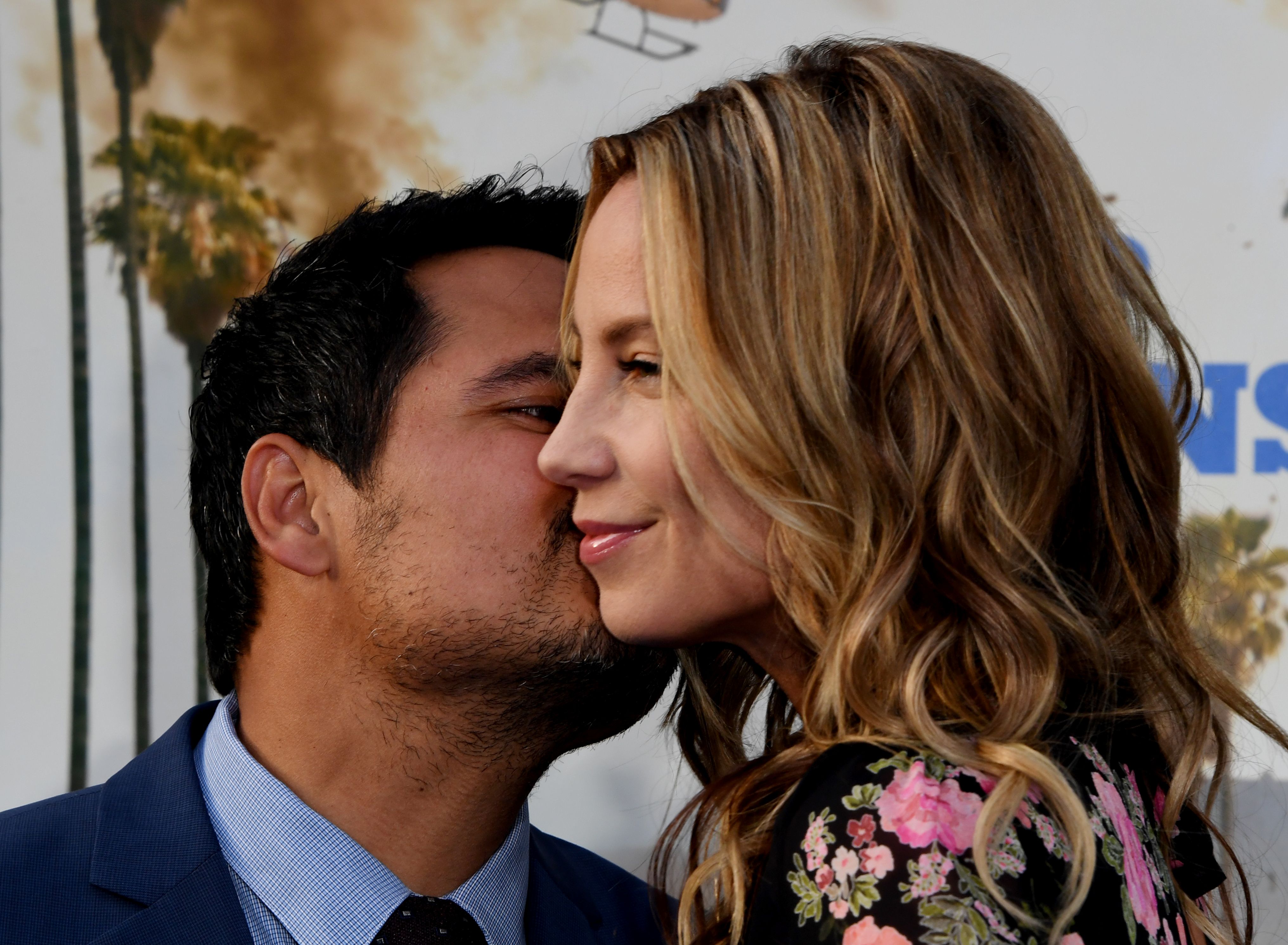 Actor Michael Pena (L) and screenwriter Brie Shaffer arrive for the premiere of "CHiPS" at the TCL Chinese Theatre in Hollywood, California, on March 20, 2017. | Source: Getty Images