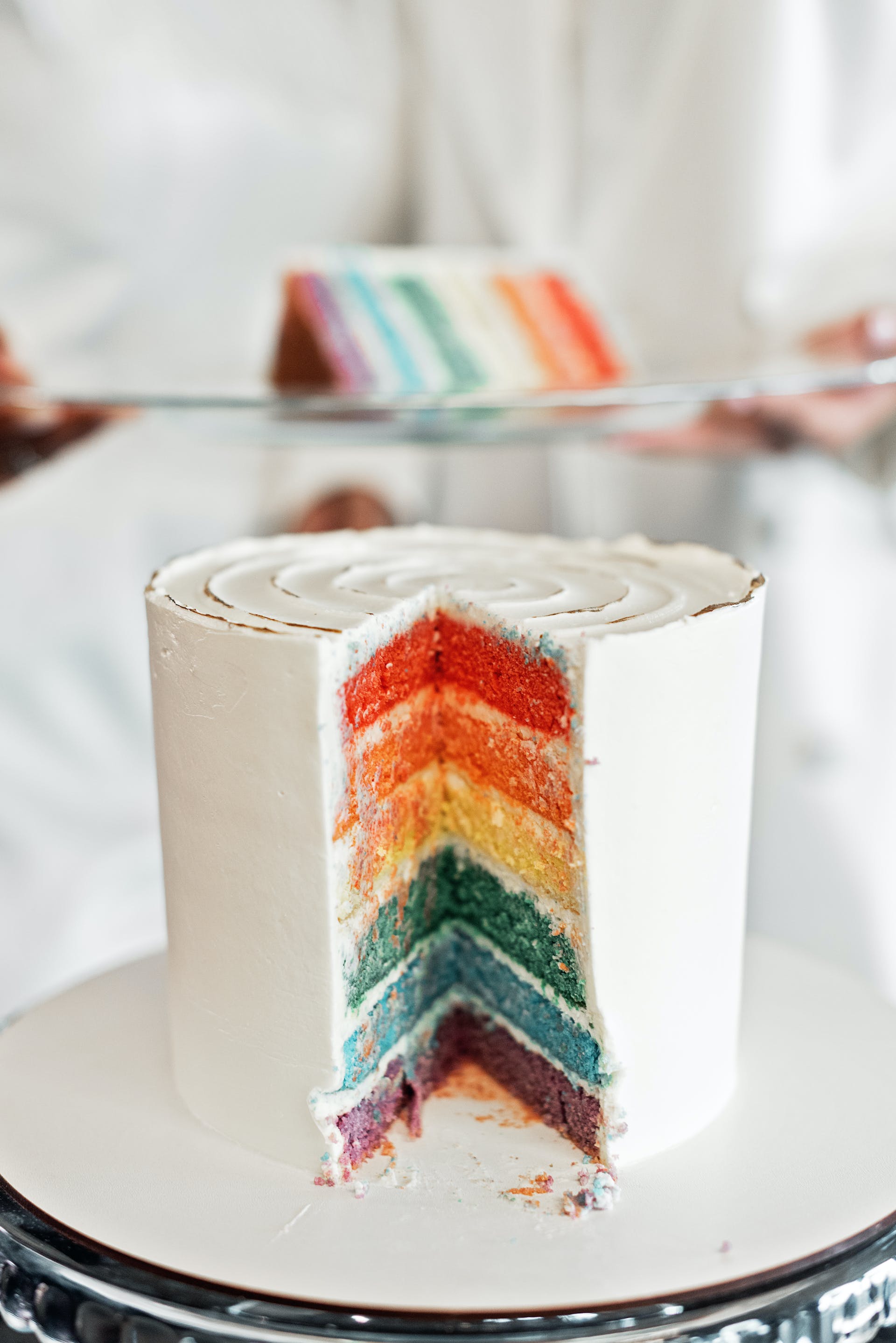 A tall cake with colorful layers | Source: Pexels