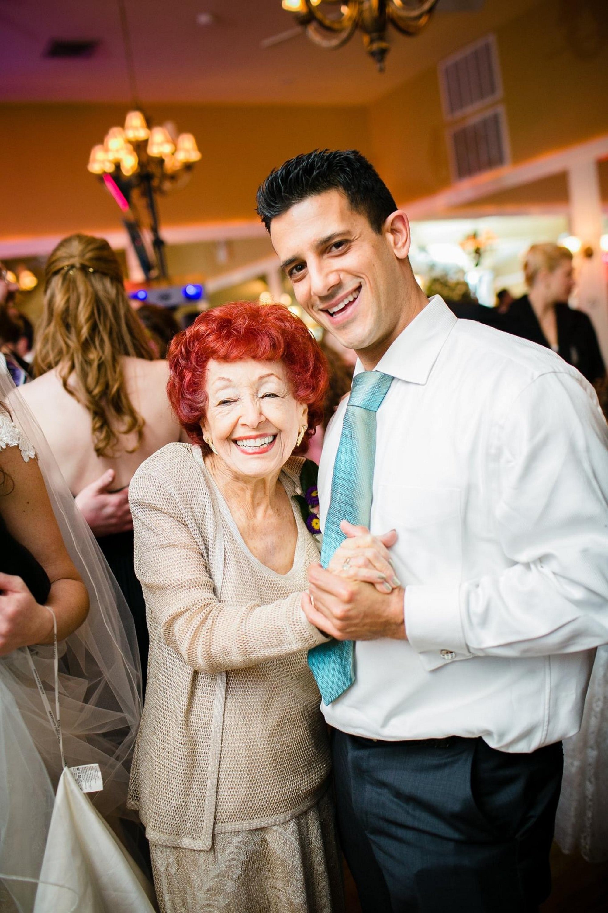 A young man and his grandmother dancing. | Source: Unsplash