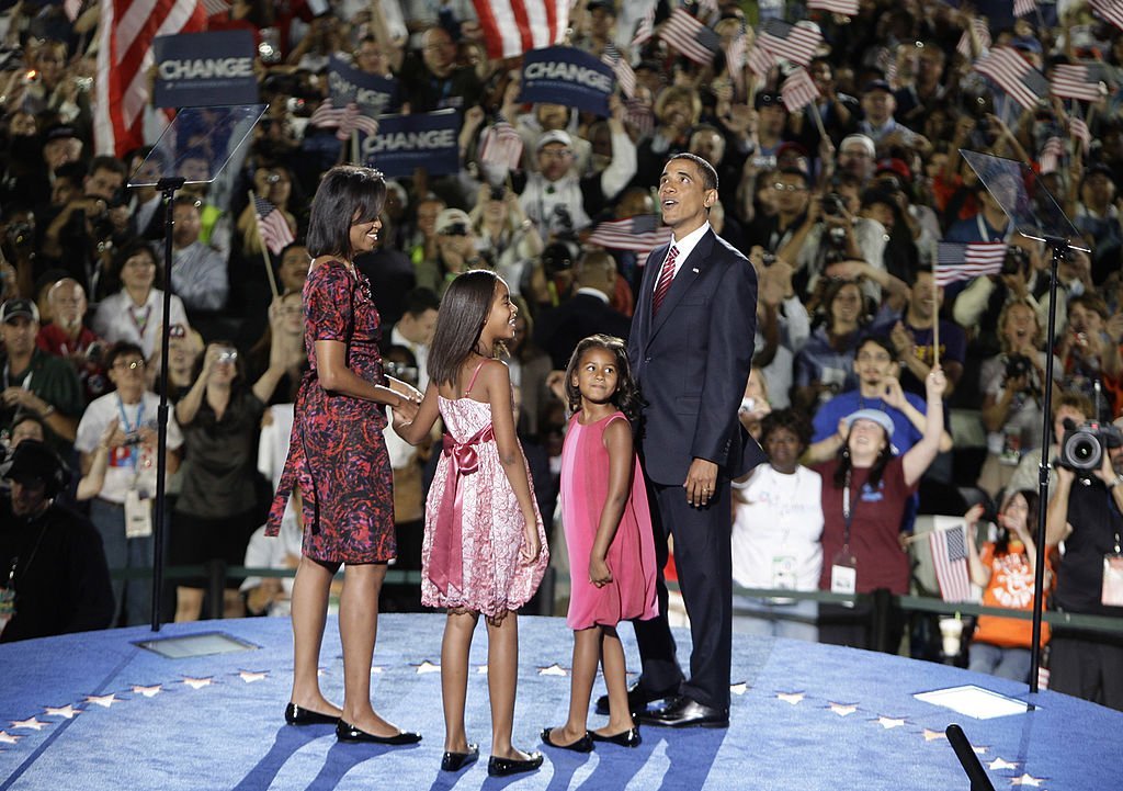 (L-R) Michelle Obama, Malia Obama, Sasha Obama & Barack Obama stand on stage after he accepted the Democratic presidential nomination on Aug. 28, 2008 in Denver, Colorado | Photo: Getty Images