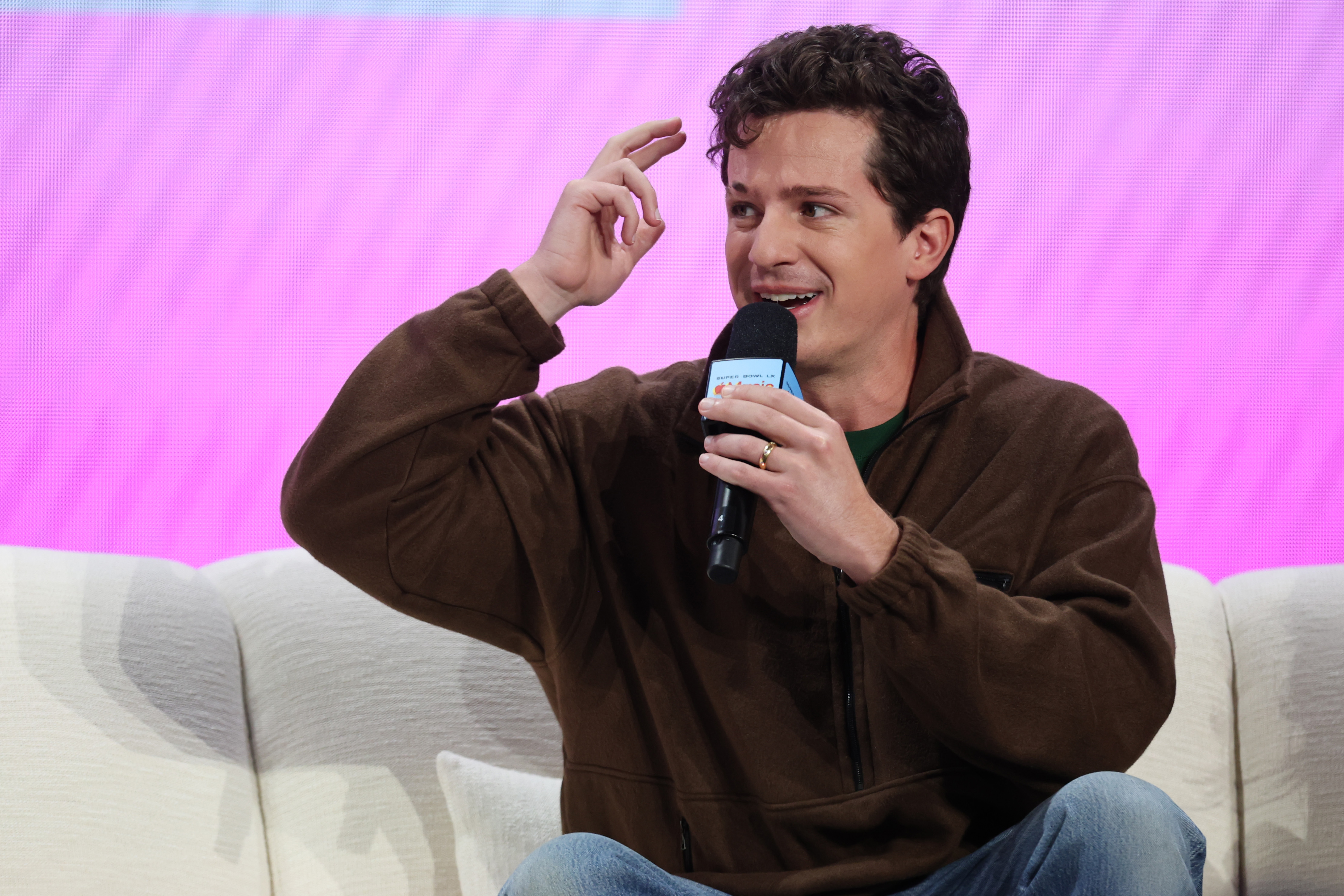 Charlie Puth speaks at the Apple Music Super Bowl LX press conference in San Francisco, California, on February 5, 2026 | Source: Getty Imges