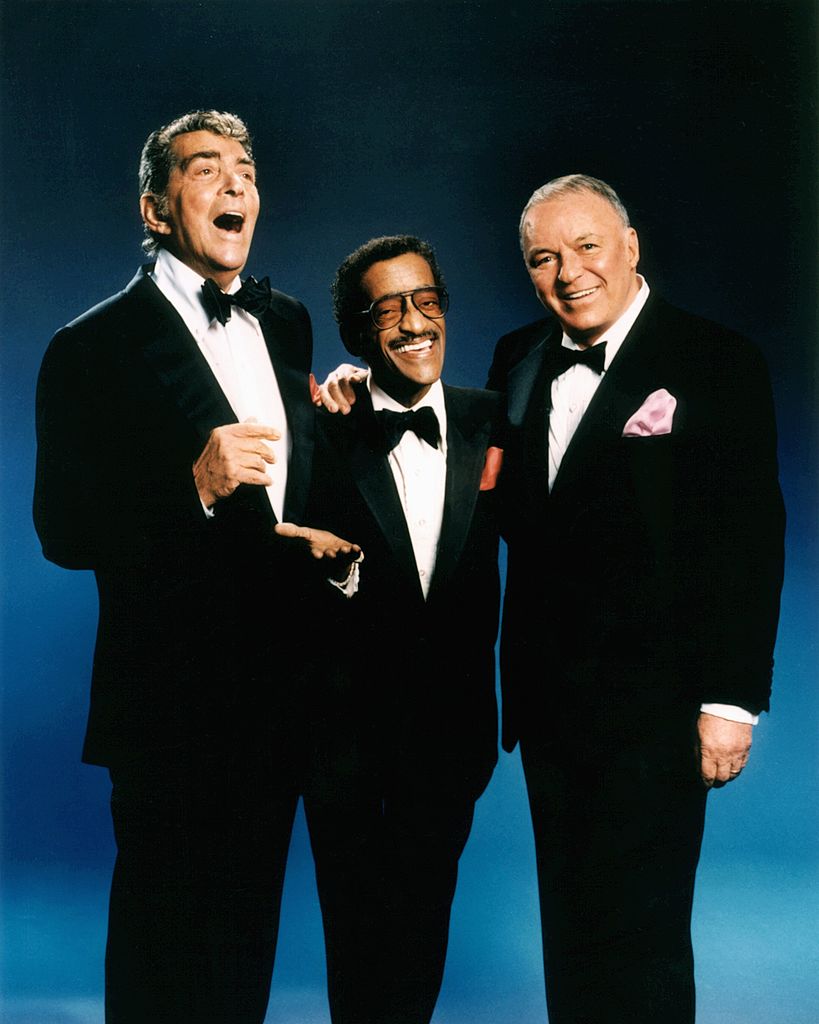 Singers and actors Frank Sinatra, Dean Martin and Sammy Davis Jr. pose for a portrait circa 1988 in Los Angeles | Photo: Getty Images