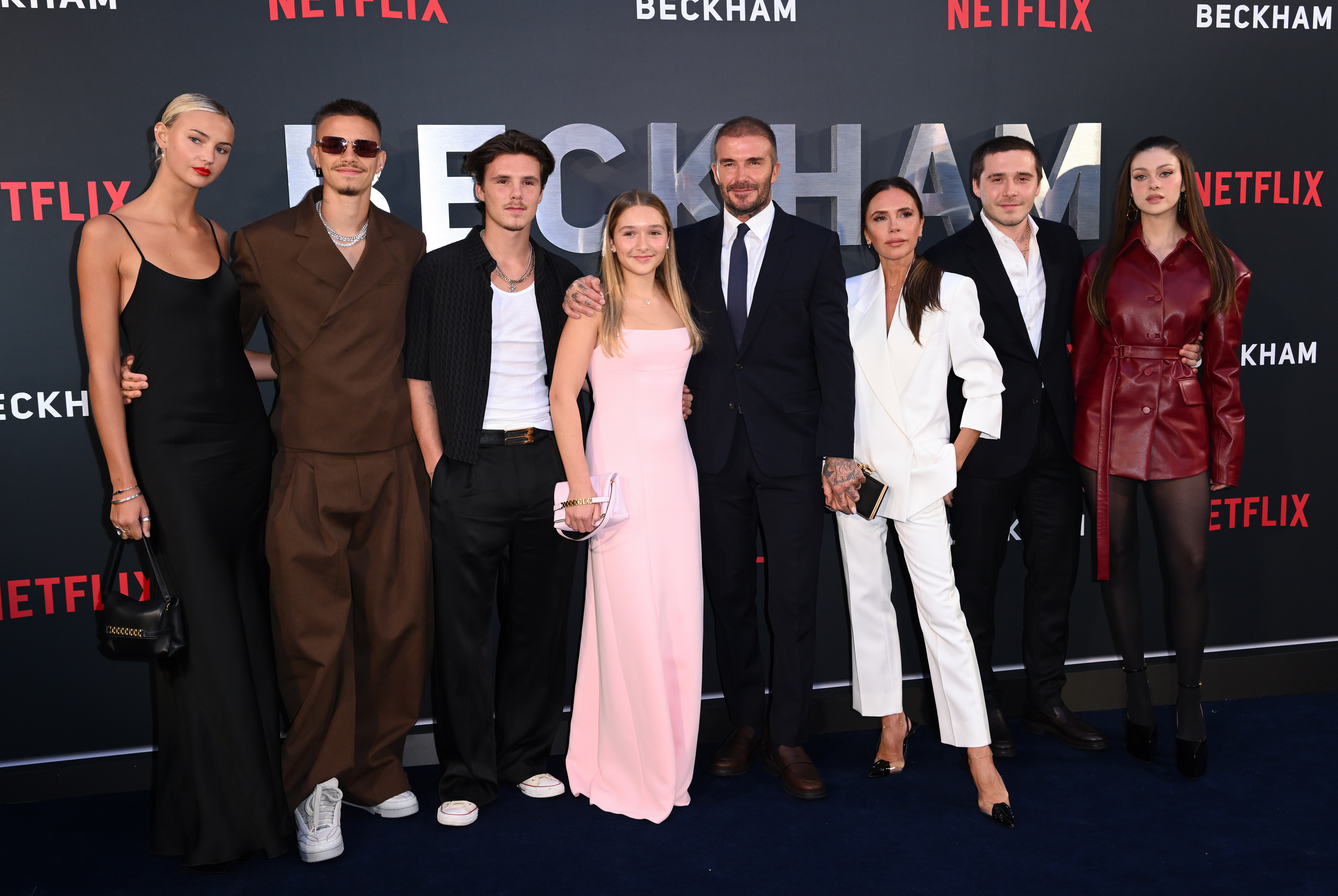 Mia Regan with Romeo, Cruz, Harper, David, and Victoria Beckham as well as Brooklyn and Nicola Peltz Beckham a the Netflix "Beckham" UK premiere at The Curzon Mayfair on October 3, 2023, in London, England. | Source: Getty Images