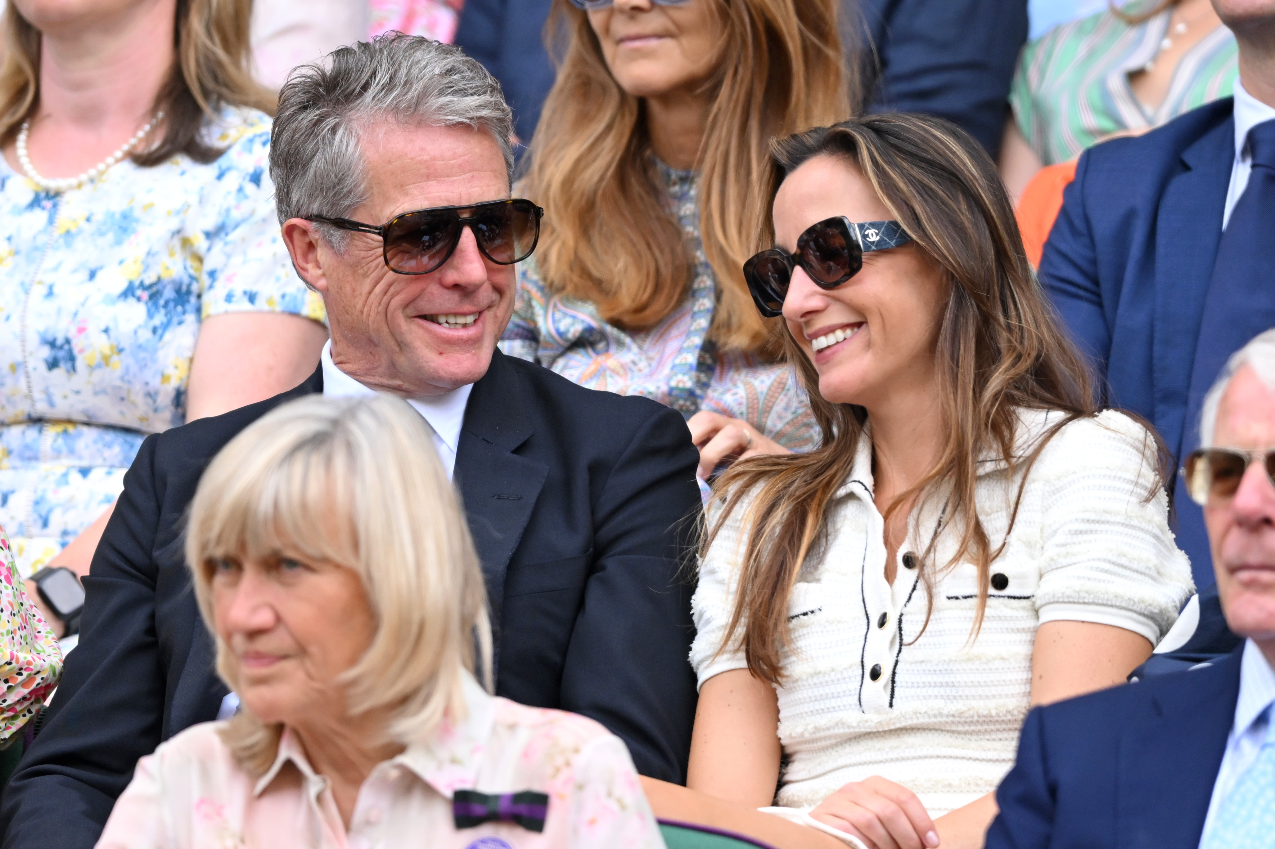 Hugh Grant and Anna Elisabet Eberstein attend day ten of the Wimbledon Tennis Championships at the All England Lawn Tennis and Croquet Club on July 9, 2025, in London, England | Source: Getty Images