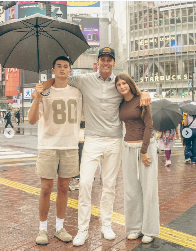 Even in the rain, Tom Brady enjoys a moment with his children, Vivian and Benjamin, as seen from a post dated December 5, 2025. | Source: Instagram/tombrady