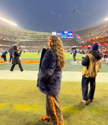 A NFL WAG posing and showing off her Chicago Bears-inspired outfit. | Source: TikTok/@simonebilesowens