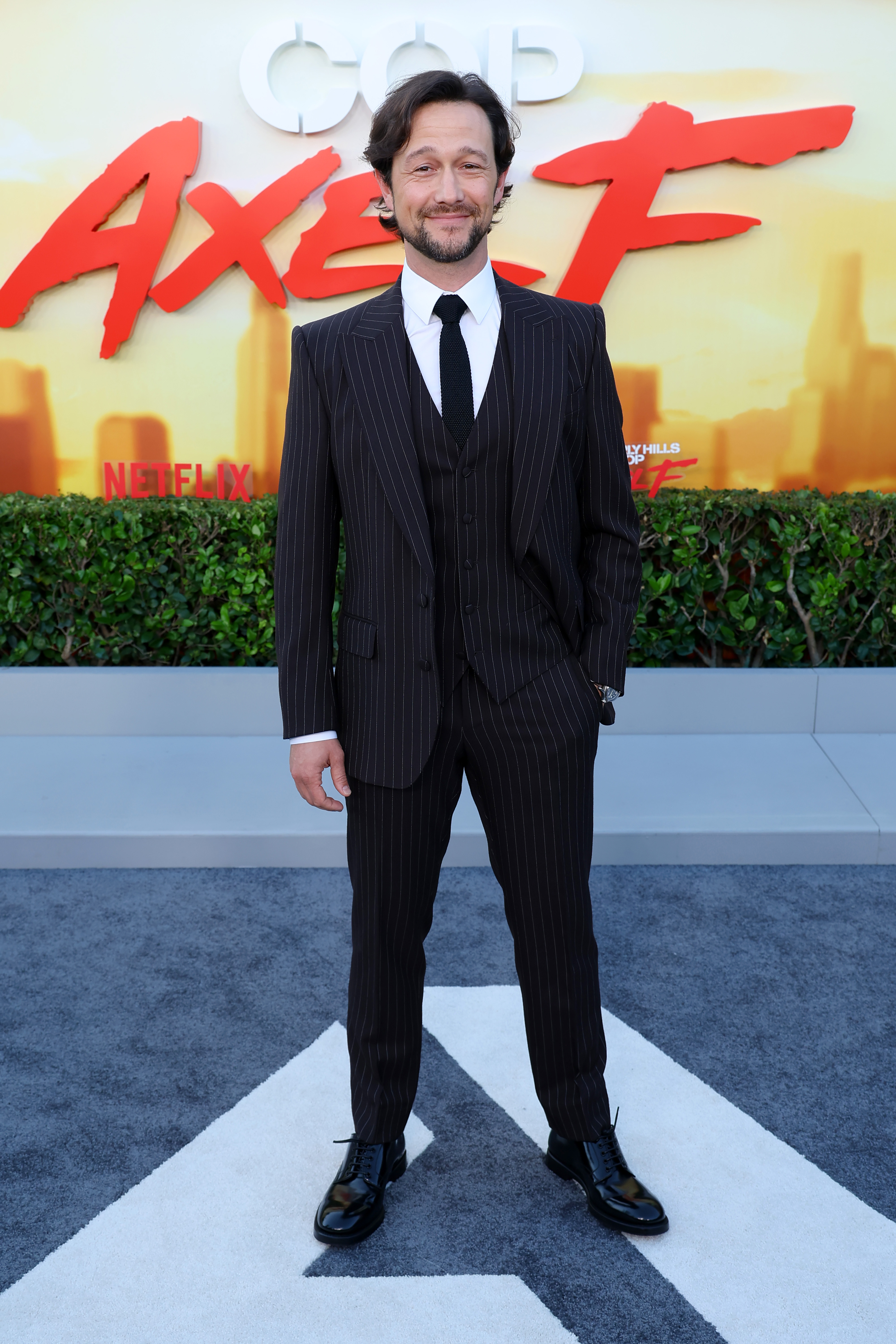 Three decades later, Gordon-Levitt stepped onto the red carpet in a sharp, pinstriped three-piece suit at the premiere of Netflix’s "Beverly Hills Cop: Axel F." Sporting a trimmed beard and tousled waves, he looked every bit the seasoned Hollywood veteran. Now known for critically acclaimed roles and his work as a filmmaker and entrepreneur, his evolution from child star to multifaceted creator has been seamless.