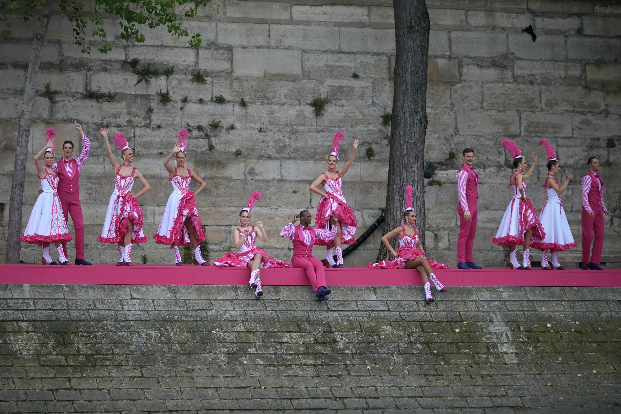 Dancers performing French Cancan choreography are pictured from the boat of Brazil's delegation sailing along the River Seine during the opening ceremony of the Olympic Games Paris 2024 in Paris, France, on July 26, 2024. | Source: Getty Images