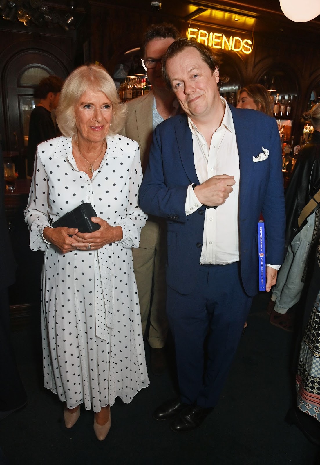 Queen Camilla and Tom Parker Bowles attended the launch of his book, 'Cooking & The Crown,' on September 5, 2024, in London, England. The event highlighted their shared love for food and royal history. | Source: Getty Images"