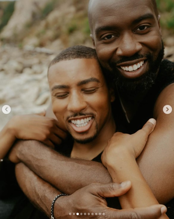 Greg Mathis Jr. and Elliott Cooper posing for their engagement announcement photoshoot in an image uploaded on July 19, 2024 | Source: Instagram/gregmathisjr