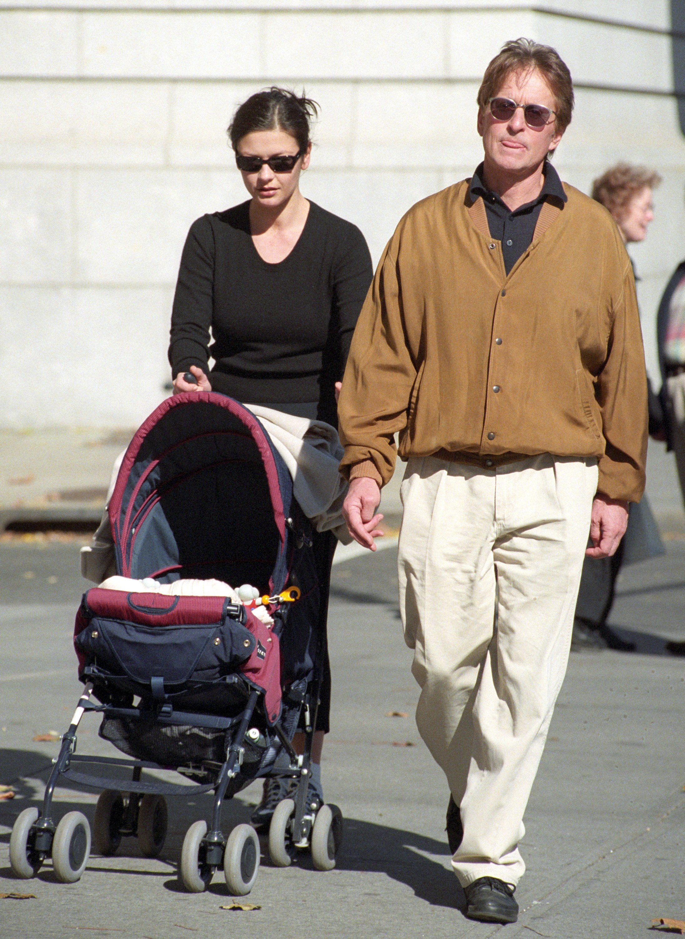 Catherine Zeta Jones and Michael Douglas with their son Dylan walking on Central Park West and 76th Street on October 28, 2000 in New York City. | Source: Getty Images