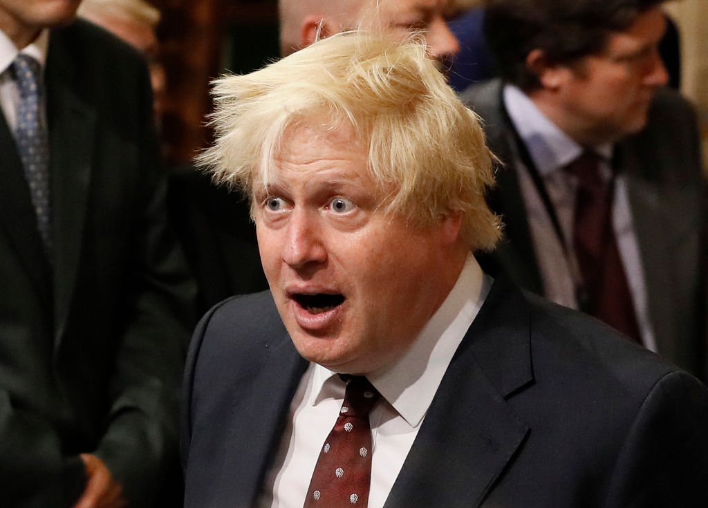 British Foreign Secretary Boris Johnson walks through the House of Commons to attend the the State Opening of Parliament taking place in the House of Lords at the Palace of Westminster | Photo: Getty Images