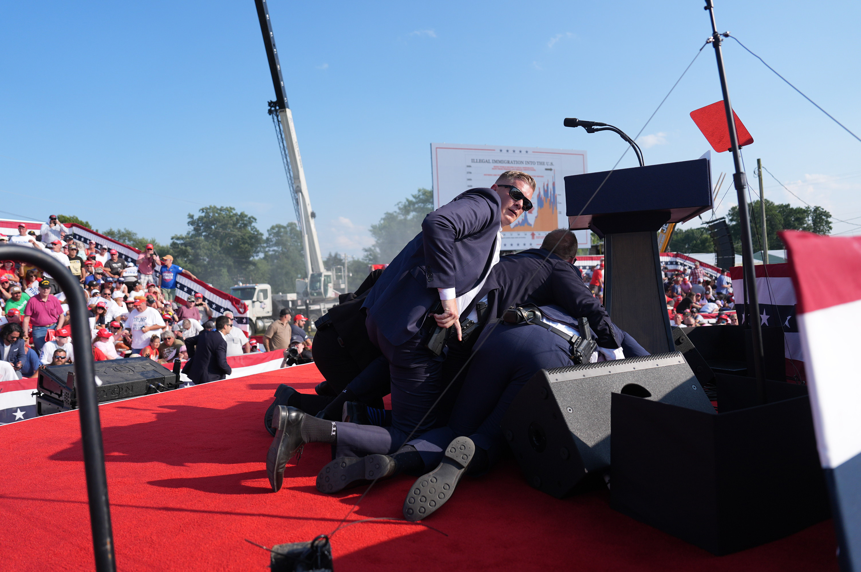 Secret service agents covering Donald Trump after the assassination attempt during the campaign rally in Butler, Pennsylvania on July 13, 2024. | Source: Getty Images