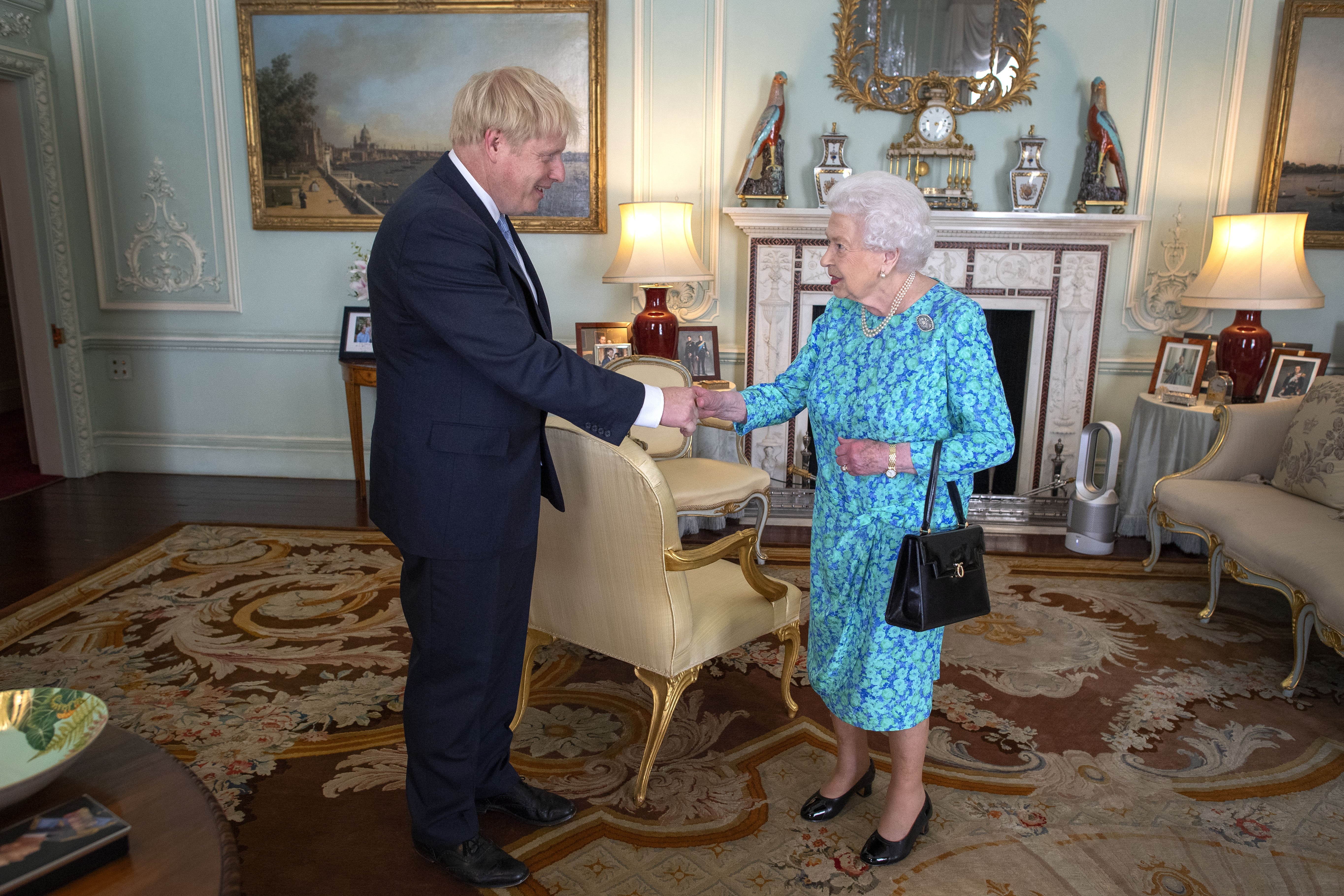 Queen Elizabeth II welcomes Boris Johnson in Buckingham Palace on July 24, 2019, in London, England. | Source: Getty Images.