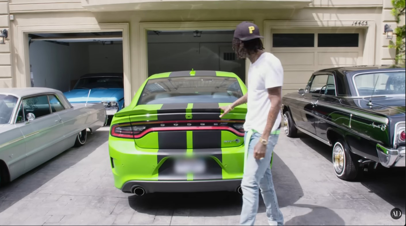 Wiz Khalifa showcases several vehicles from his car collection outside his Los Angeles home during the Architectural Digest tour. | Source: YouTube/Architectural Digest