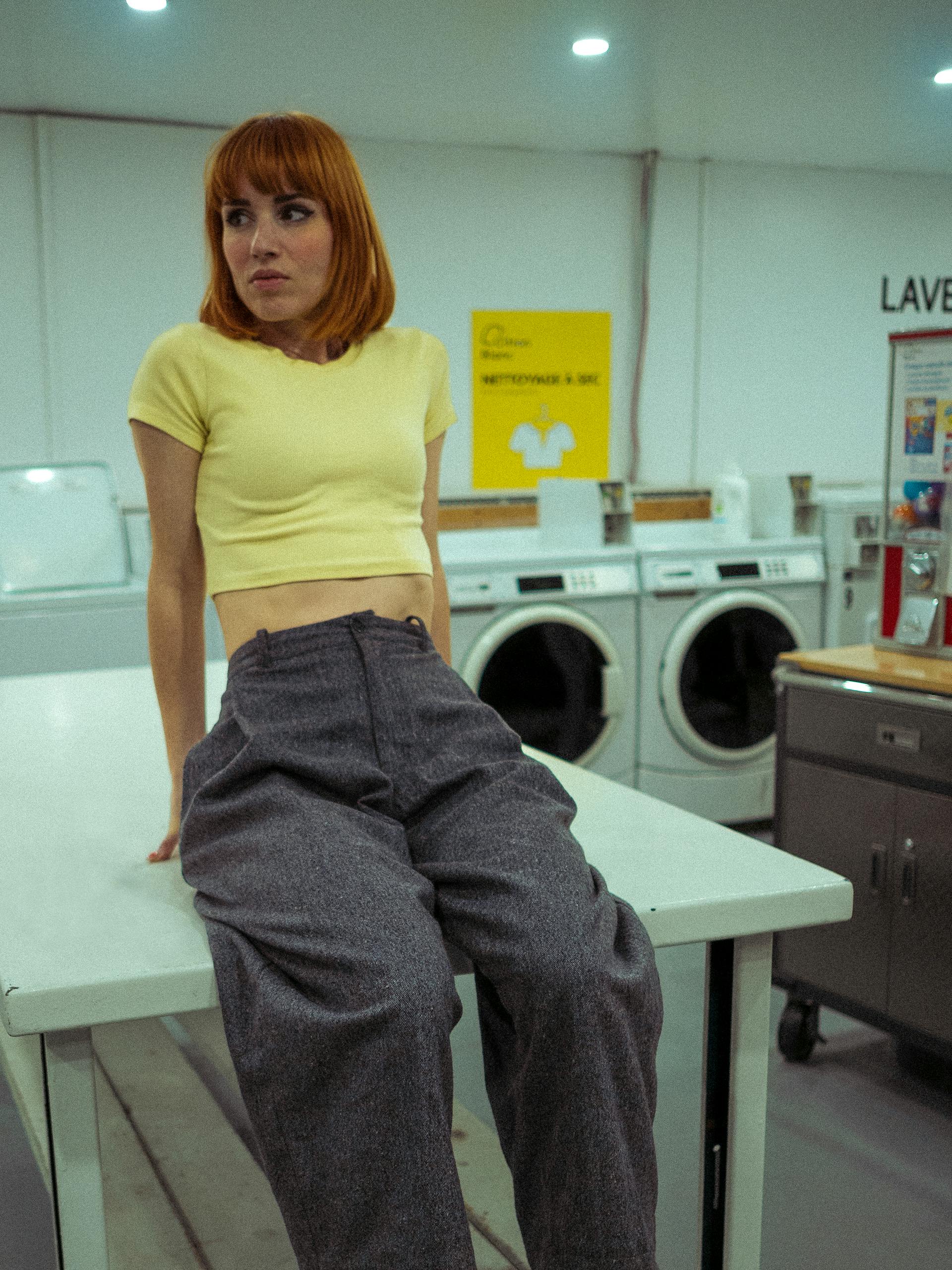 A woman in a laundry room | Source: Pexels