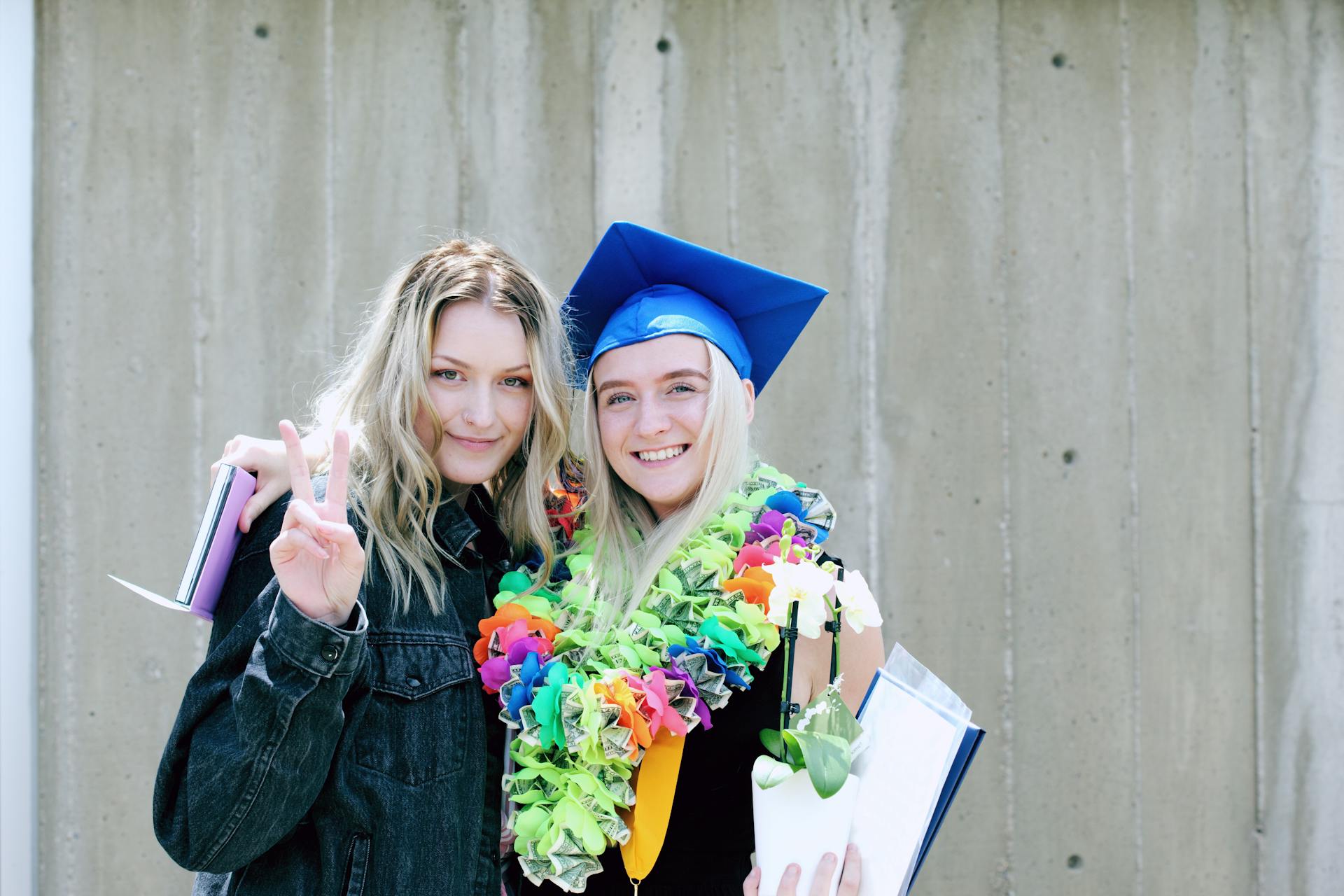 Twin sisters celebrating their graduation | Source: Pexels