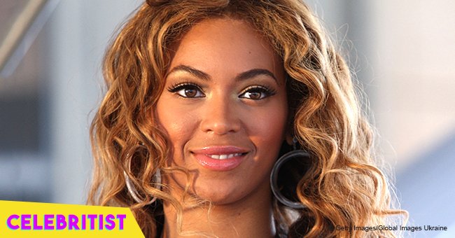 Beyoncé bares cleavage in plunging gray suit & tan checked coat in stunning photo